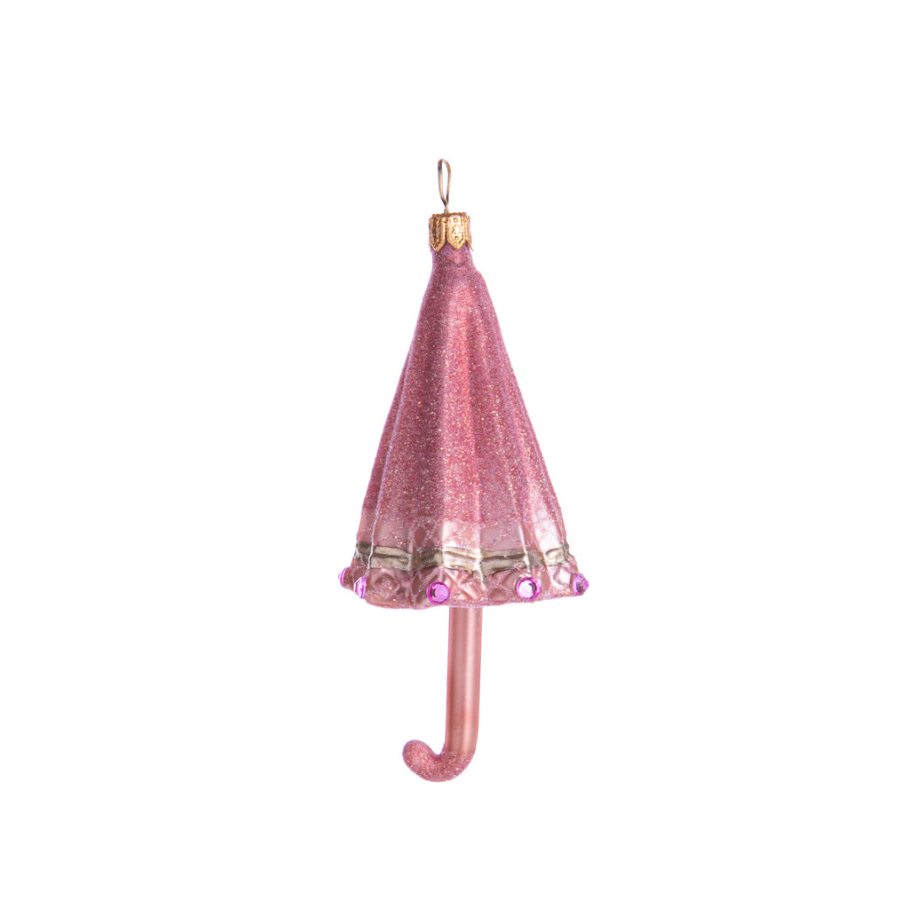 Come rain or shine, add some pink glitter to your holiday decor. Prettily hand-decorated with glitter and rhinestones, this is an ornament which is sure to brighten up even the greyest of days. Hand-decorated glass ornament Dimensions: 4" H