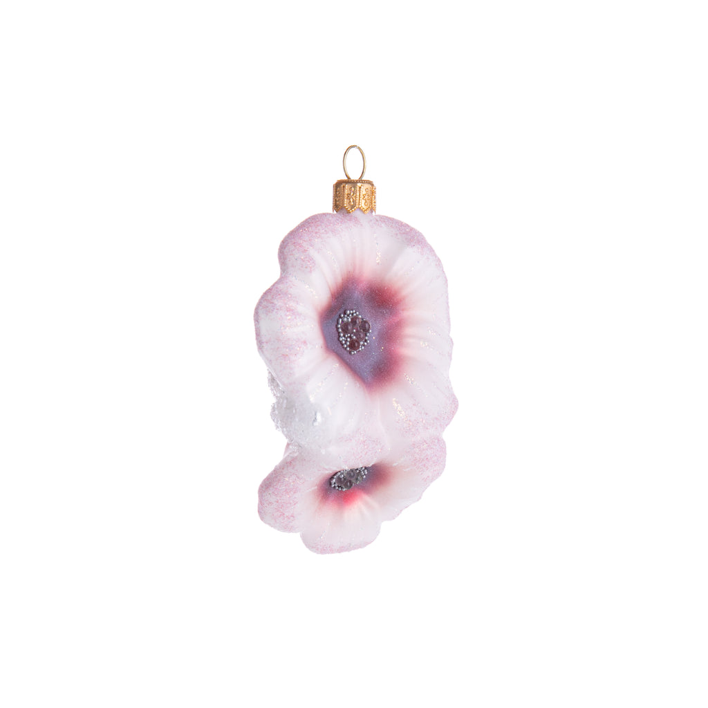 Evoke the beauty of a Japanese rose, also known as a "rosa rugosa." In stunning shades of pink and hand-decorated with glitter and a textured center, this glass ornament brings serenity and beauty to your holiday tree. Hand-decorated glass ornament Dimensions: 4.25" x 2.75"