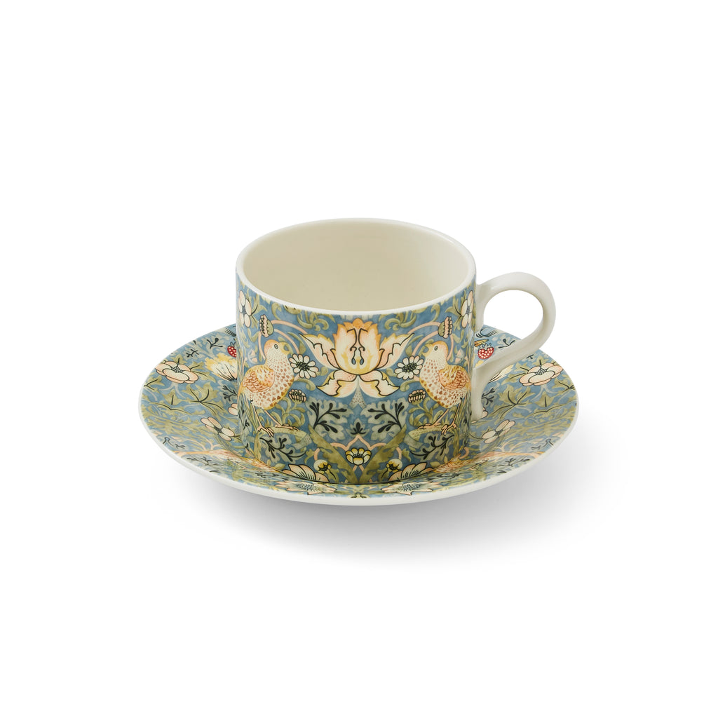 Celebrate William Morris with this teacup and saucer set decorated with William Morris' Strawberry Thief. William Morris is one of the greatest designers of the Arts and Crafts movement and many of his works are in the Huntington collections. 10 oz. capacity Material: Porcelain Dishwasher, Microwave, and Freezer-safe