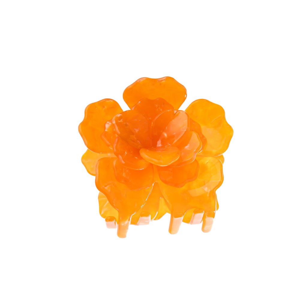 This origami marigold hair clip has 3D construction, truly capturing the essence of a marigold in bloom. These hair clips are crafted from cellulose acetate, an eco-friendly, biodegradable material made from recycled wood pulp. The clip is double sided for a perfect look from every angle! Dimensions: 2.5" x 2" 