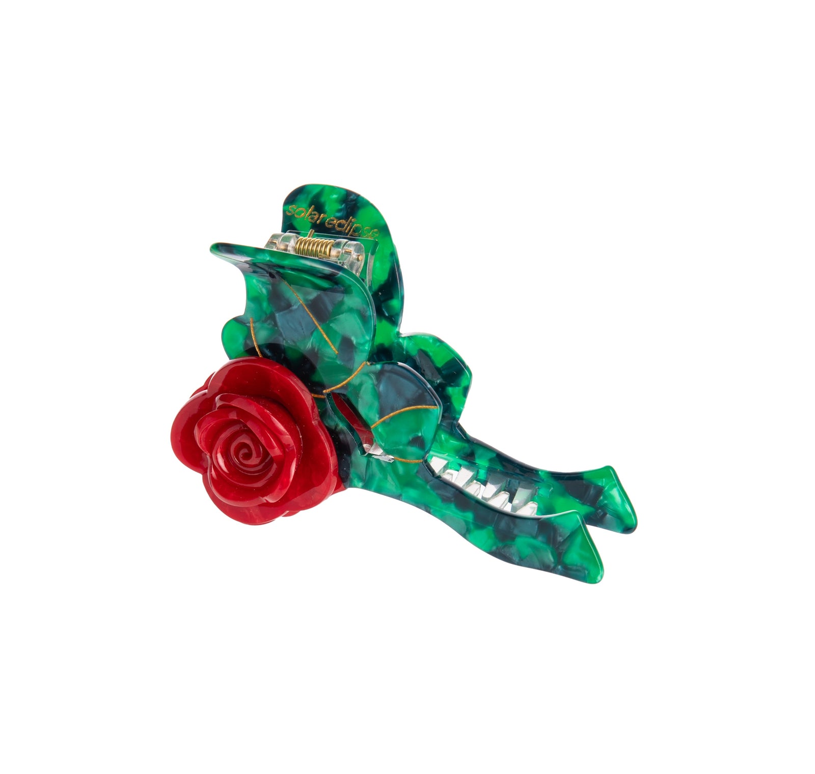 Add a rosy flourish with this hand-finished origami rose stem claw hair clip. It is double sided and has hand-painted accents. Made from premium materials including a biodegradable wood pulp acetate, making these clips kind to the environment! 100% plastic-free and recyclable packaging Dimensions: Approx. 4" x 2.5" 