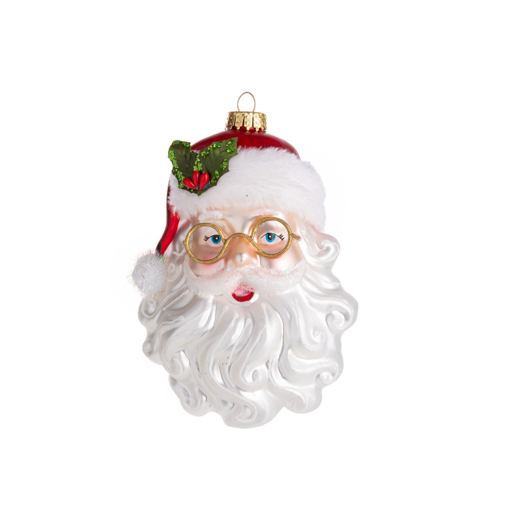 This vintage-inspired Santa head ornament is perfect to get you in the holiday spirit! Hand-decorated and glittered, with fur on his hat, glitter pom-poms, and lots of glitter detail, this ornament is perfect for a retro holiday look.  Dimensions: 6.5" Height Material: Glass, Polyester, Resin