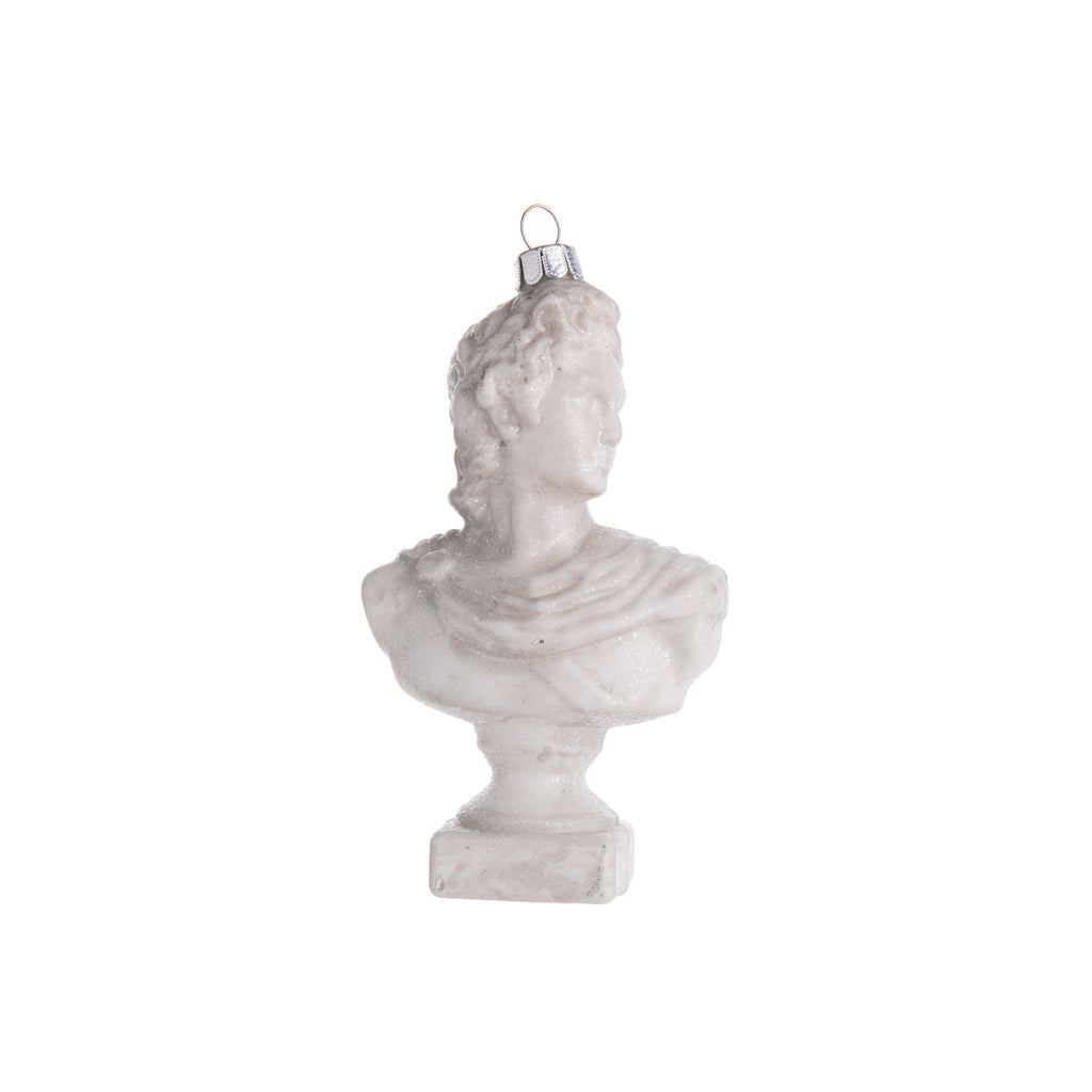 Celebrate the classics with this ornament based on Apollo, the Greek god. This glass ornament features the bust of Apollo, who was known as the god of healing, the sun, archery, music, and much more. Hand-decorated with glitter, introduce Apollo's regal vibes into your home and holiday decor. Dimensions: 5" height 