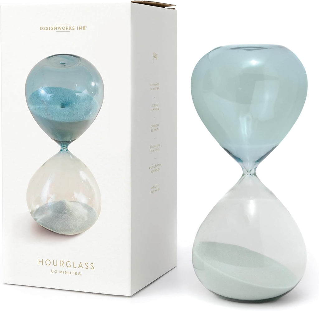 This light blue hourglass that is timed for 60 minutes is for any place you need to set a timer and get some focus.  With ombré tinted glass and light blue colored sand, this hourglass is modern and pretty to stick anywhere in your home or office. Dimensions: 9.25" tall 60 minute timer