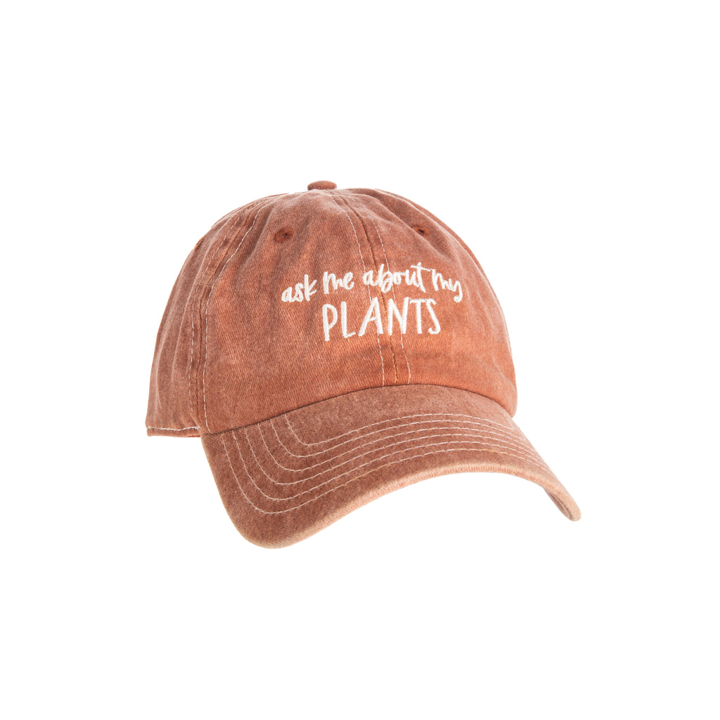 This soft, washed rust-colored baseball cap features the phrase 'Ask Me About My Plants' in a text embroidery on the front, and is sure to provoke curious questions about your garden. The cap features an adjustable metal buckle to ensure the perfect fit. Materials: Cotton, Metal One size fits most Adjustable buckle