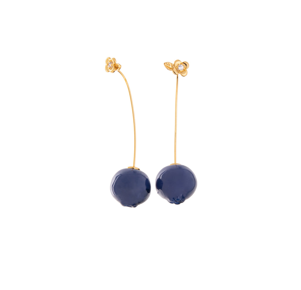 With sparkling floral studs, these resin blueberries dangle from your ears with the utmost charm. Perfect for a day at the blueberry farm, or a sweet evening out, these are the ultimate unique pair of earrings. Material: Brass, Resin, CZ Dimensions: Approx. 2" Length, 0.5" Width Wire drop closure Lead and Nickel-free