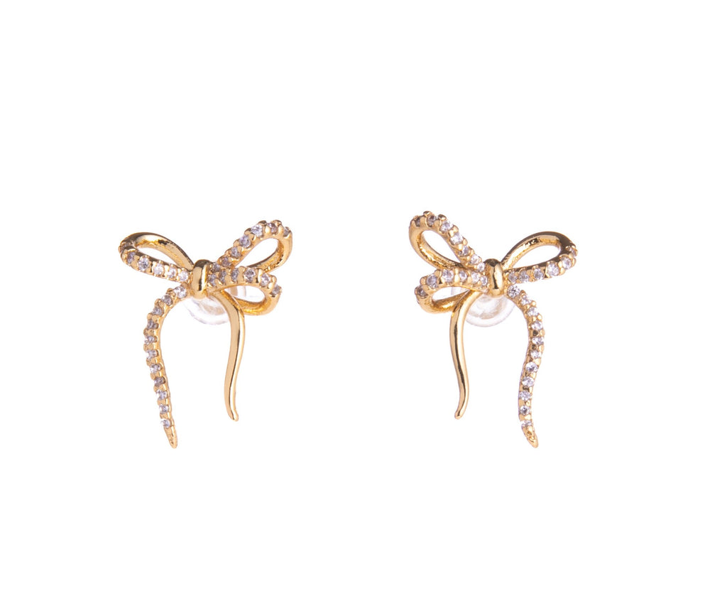 Adorn your ears with these dainty and delicate bows. With gold-plated brass detail and CZ sparkle, these stud post earrings will add subtle glam to any look. Perfect for a birthday gift to a loved one, or to yourself. Gold-plated Brass, CZ Stud post backing Dimensions: Approx. 0.75" Lead and Nickel-free