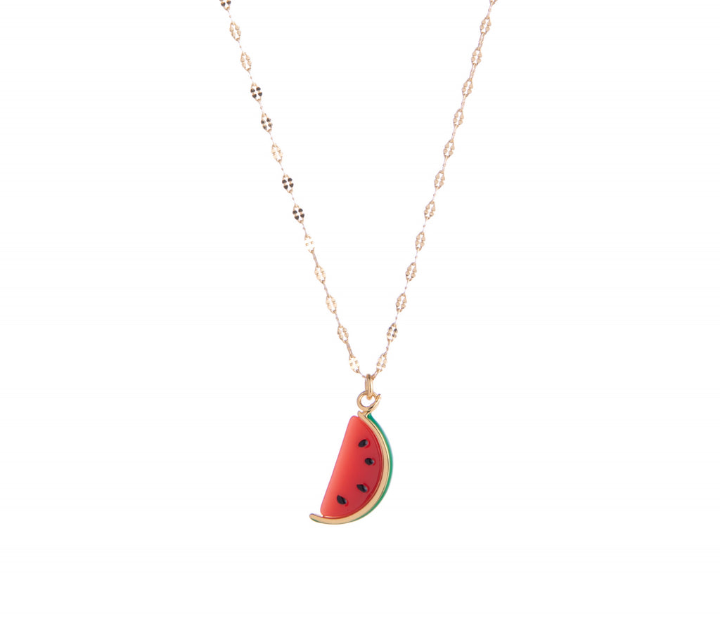 This vibrant watermelon pendant necklace features red, green, and black enamel detail as well as a gold brass dainty chain. This necklace is perfect for adding a pop of color to any outfit! Material: Brass, Resin, Enamel Dimensions: 16" plus 2" extender Lobster clasp closure Lead and Nickel-free