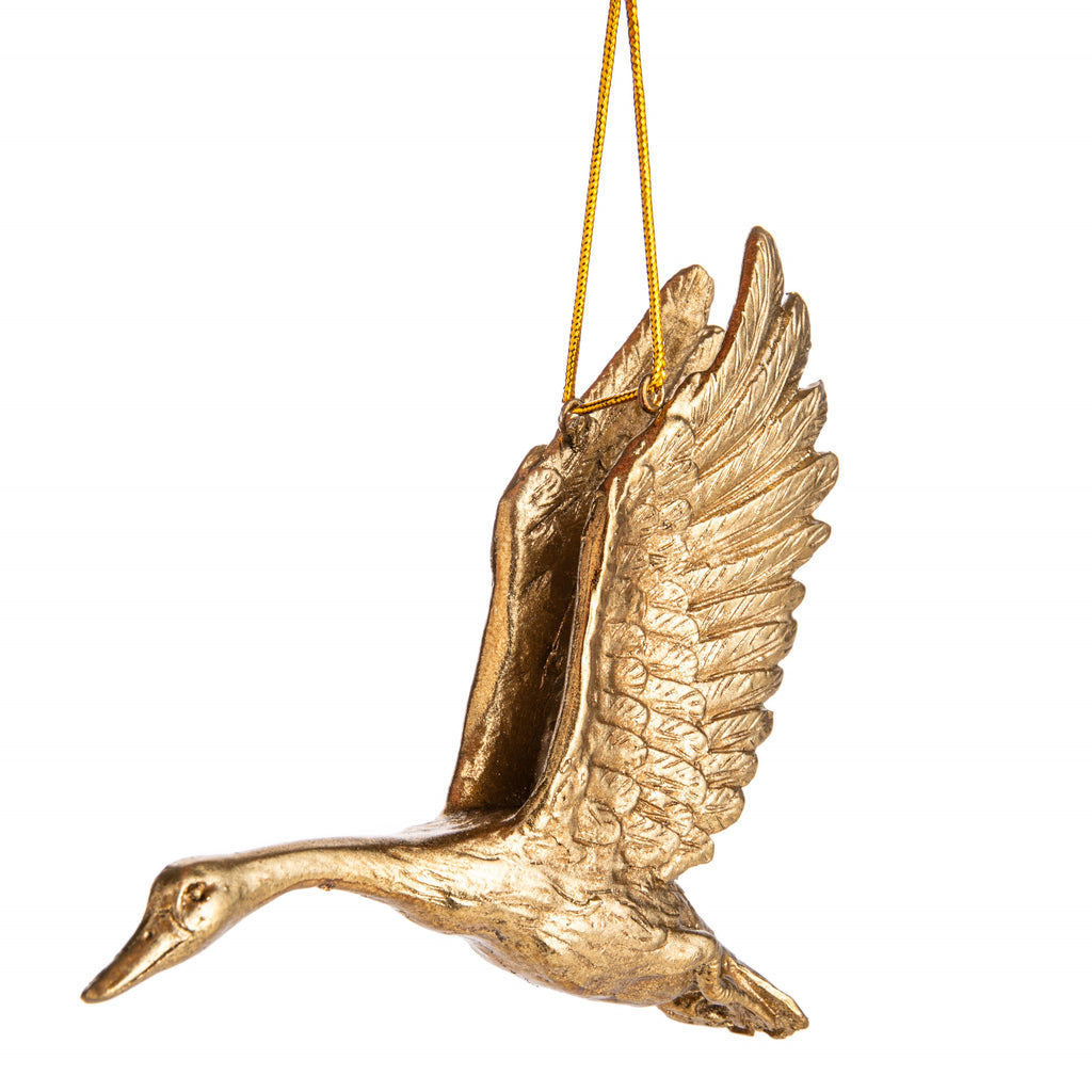 Geese are often revered as guardians and symbolize protection in many mythologies and folklore across the world. Add this wonderful symbolism to your holiday decor with this detailed golden flying goose ornament. 