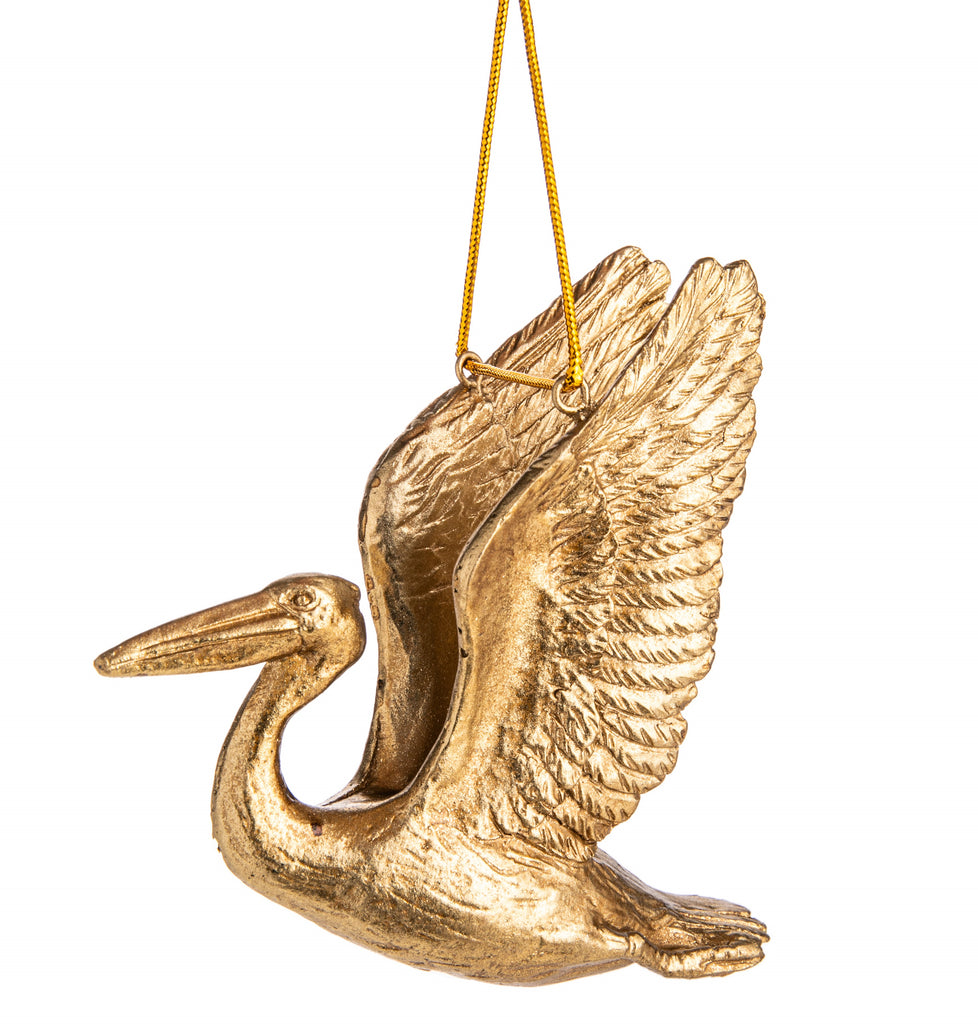 The Pelican is a symbol for focus, persistence, and self-initiation with style and flair too. Add this wonderful symbolism to your holiday decor with this detailed golden flying pelican ornament. 