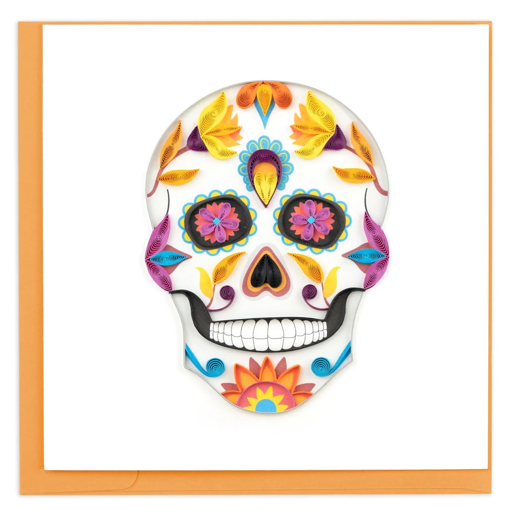 Whether you are celebrating Halloween, Dia de Los Muertos, or just love skeletons - this handcrafted sugar skull is the greeting card for you! This detailed quilled card is handmade by a skilled artisan and takes one hour to create.  Greeting card with orange envelope Blank inside Dimensions: 6" x 6"