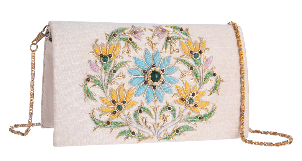 This unique clutch purse has been entirely handcrafted by highly skilled artisans, proudly working in the century's old tradition of Zardozi embroidery.