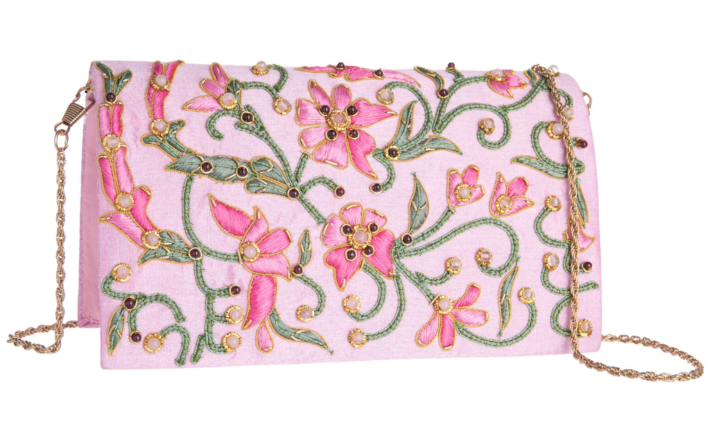 This unique clutch purse has been entirely handcrafted by highly skilled artisans, proudly working in the century's old tradition of Zardozi embroidery. Zardosi is an intricate, multidimensional style of embroidery which creates an opulent, three-dimensional effect using metallic threads and semi-precious stones.