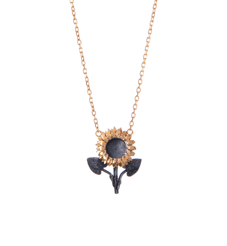 Wear and spread joy with this sunflower stalk necklace. With gold detail for the petals, the rest of the pendant is oxidized silver to make the yellow stand out and shine like a real sunflower.