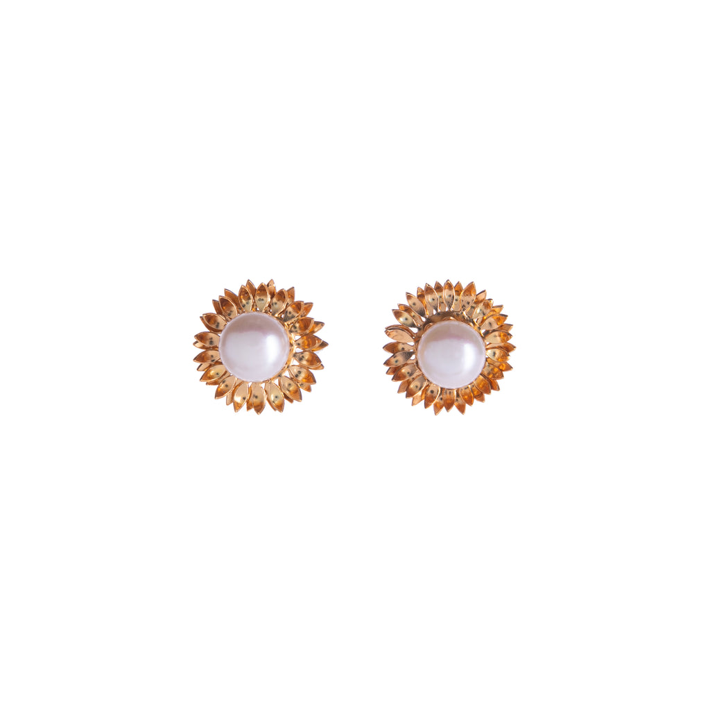 Brighten your day with the positivity of a sunflower. With gold detail and a freshwater pearl in the center, these stud earrings will help you to shine.