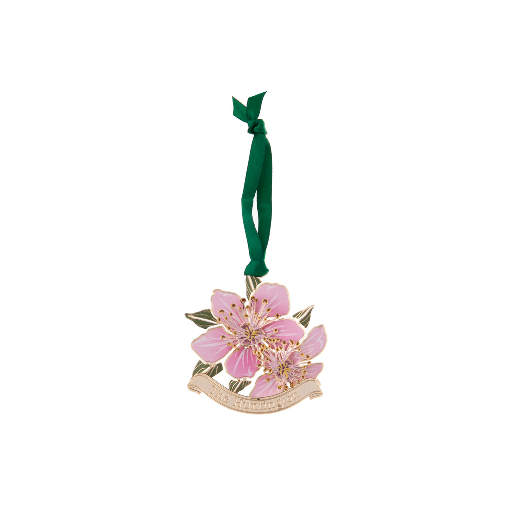 This etched brass ornament is one of a collection of four which depict vignettes from around the Huntington's gardens. From the Chinese Garden, a blooming cherry blossom in shades of pink. Finished in 24k gold with hand-lacquered color.  Dimensions: 3" x 2.5" Packaged in a gift box Exclusive to the Huntington Store