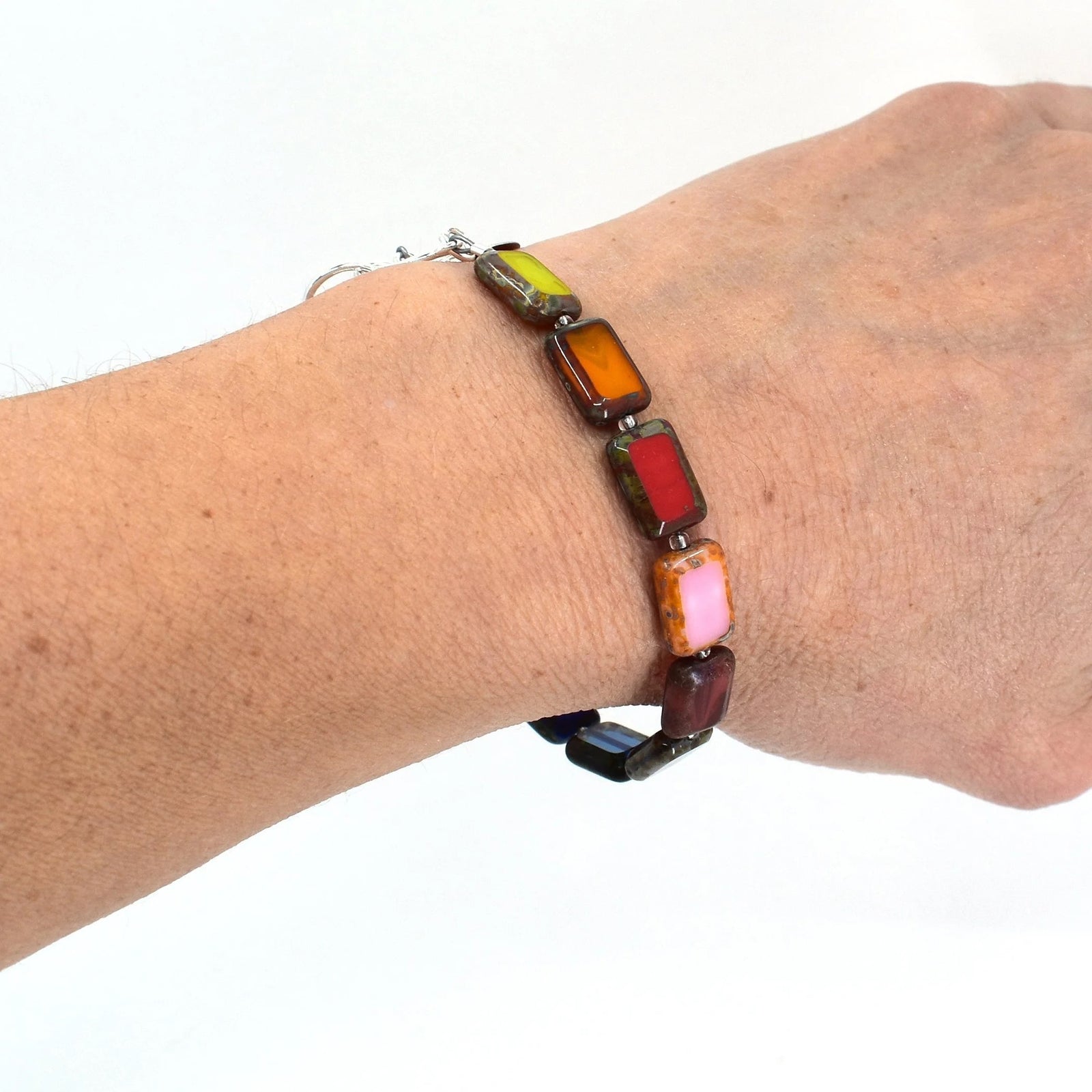 This handmade bracelet with multicolor glass beads can be paired with any color you wear. Additionally the bracelet's adjustable sterling silver toggle clasp will ensure a comfortable fit for most wrists as it can adjust from 7.25" to 8.5". Glass beads Sterling silver toggle clasp