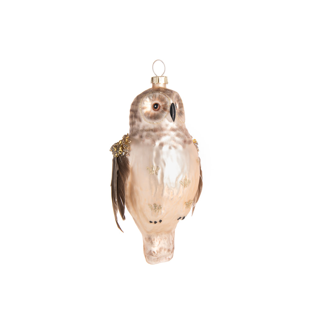 This gold owl ornament will light up your holiday decor. Hand-decorated, this owl shimmers with hand-painted detail, feathered wings, and lots of gold glitter. 