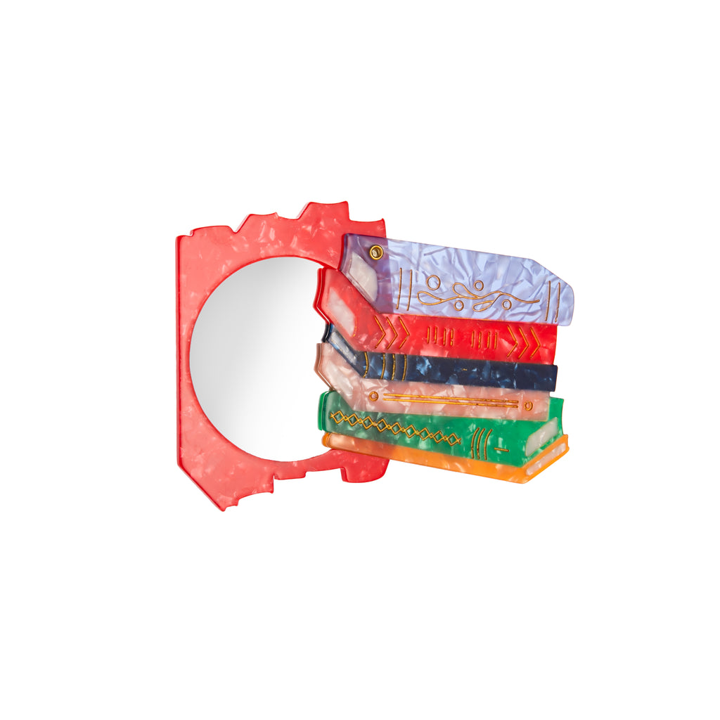 This book stack compact mirror is crafted from cellulose acetate which is an eco-friendly, biodegradable material made from recycled wood pulp. The compact is double-sided and hand-painted. Would be great to throw into your daily bag. Dimensions: Approx. 3.5" x 2.7" Material: Eco-friendly cellulose acetate Handmade