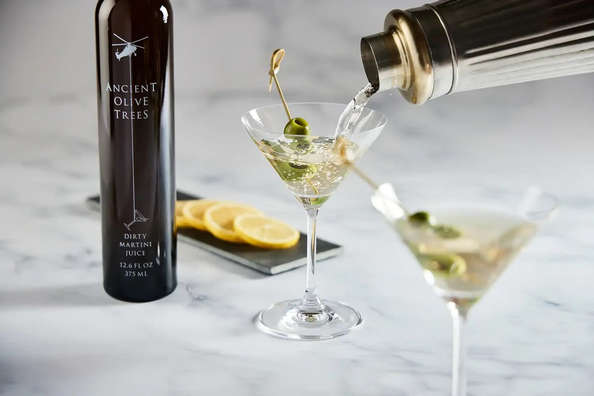 This Dirty Martini juice mixer is made from premium olives nurtured in aging barrels that are triple-filtered. This olive juice mixer is perfect for the optimal Dirty Martini. Made from harvested California olives, this Dirty Martini mixer would be wonderful at your cocktail party. 12.6 fl. oz. Produced in California