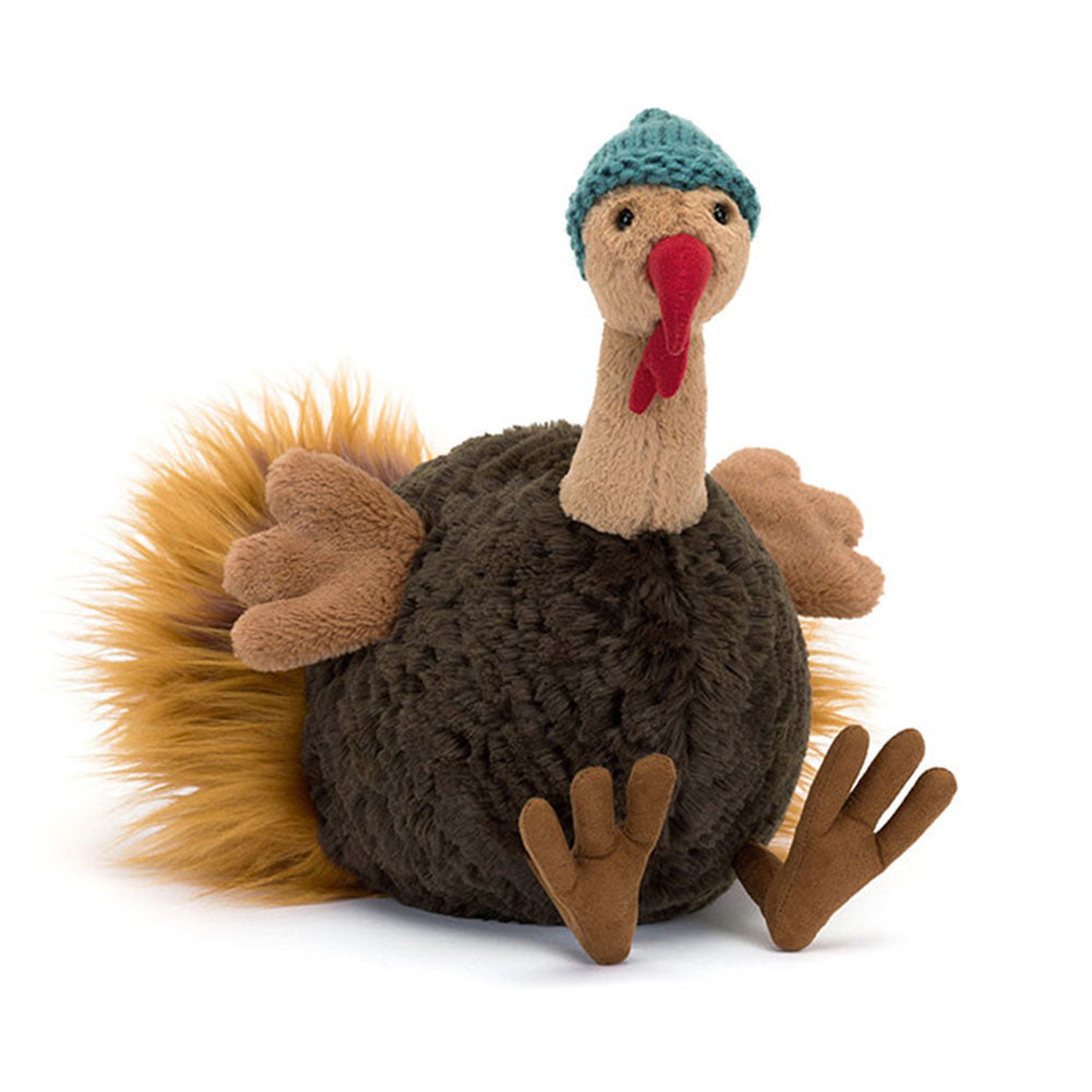 Theo the turkey is dressed to impress! He's got a teal beanie, honey feet, a cocoa tummy, a silky ginger tail, and a suedette caruncle (also known as the wobbly bit under his beak). Theo the turkey is the coziest friend to keep you warm. Dimensions: 11.4" x 5.5" x 7.9" Material: Polyester, Acrylic, PE Beans, Hard Eye