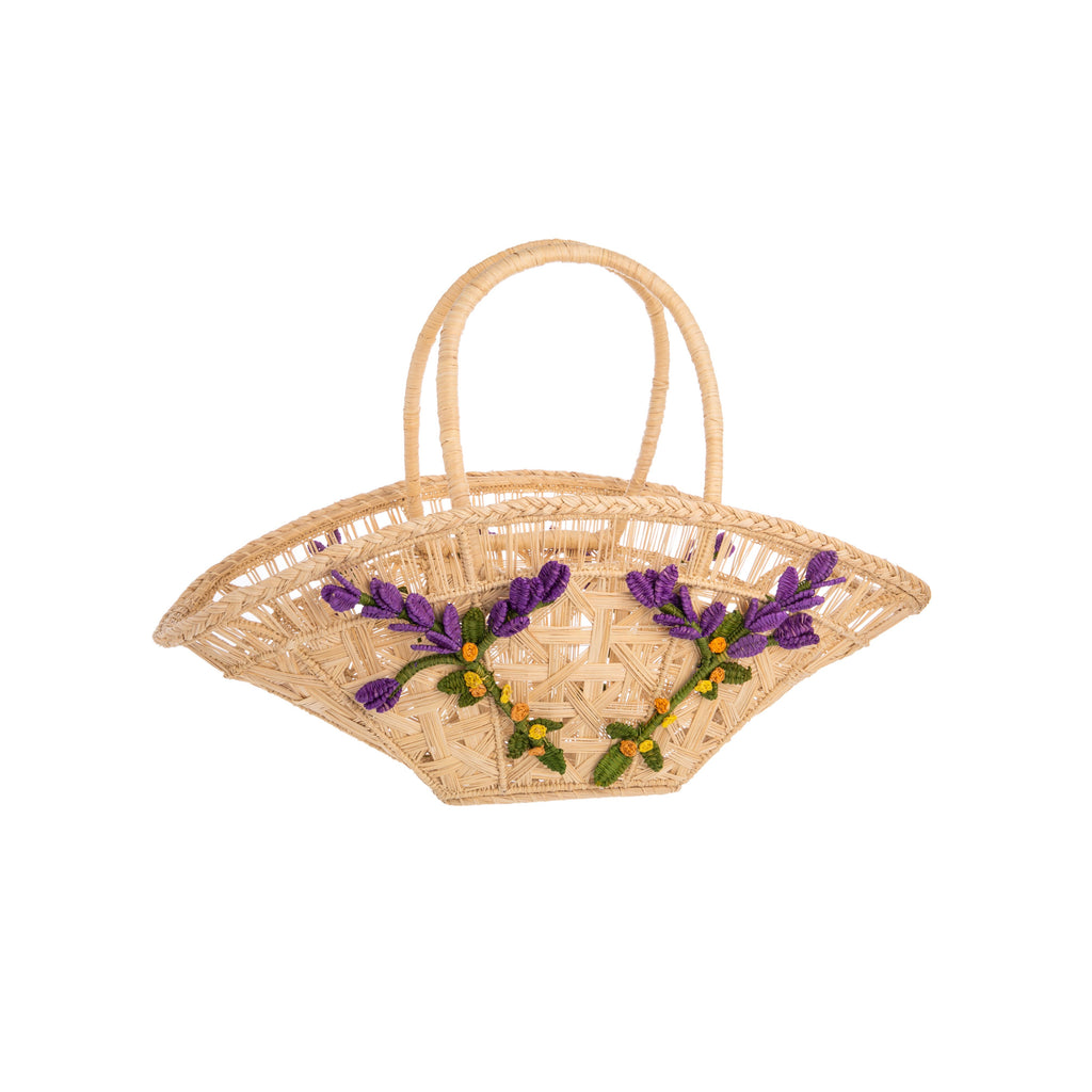 This hand-woven basket is perfect for evoking rustic glamour! This embroidered basket was made by hand in Columbia and is made from dried iraca palm leaves. 