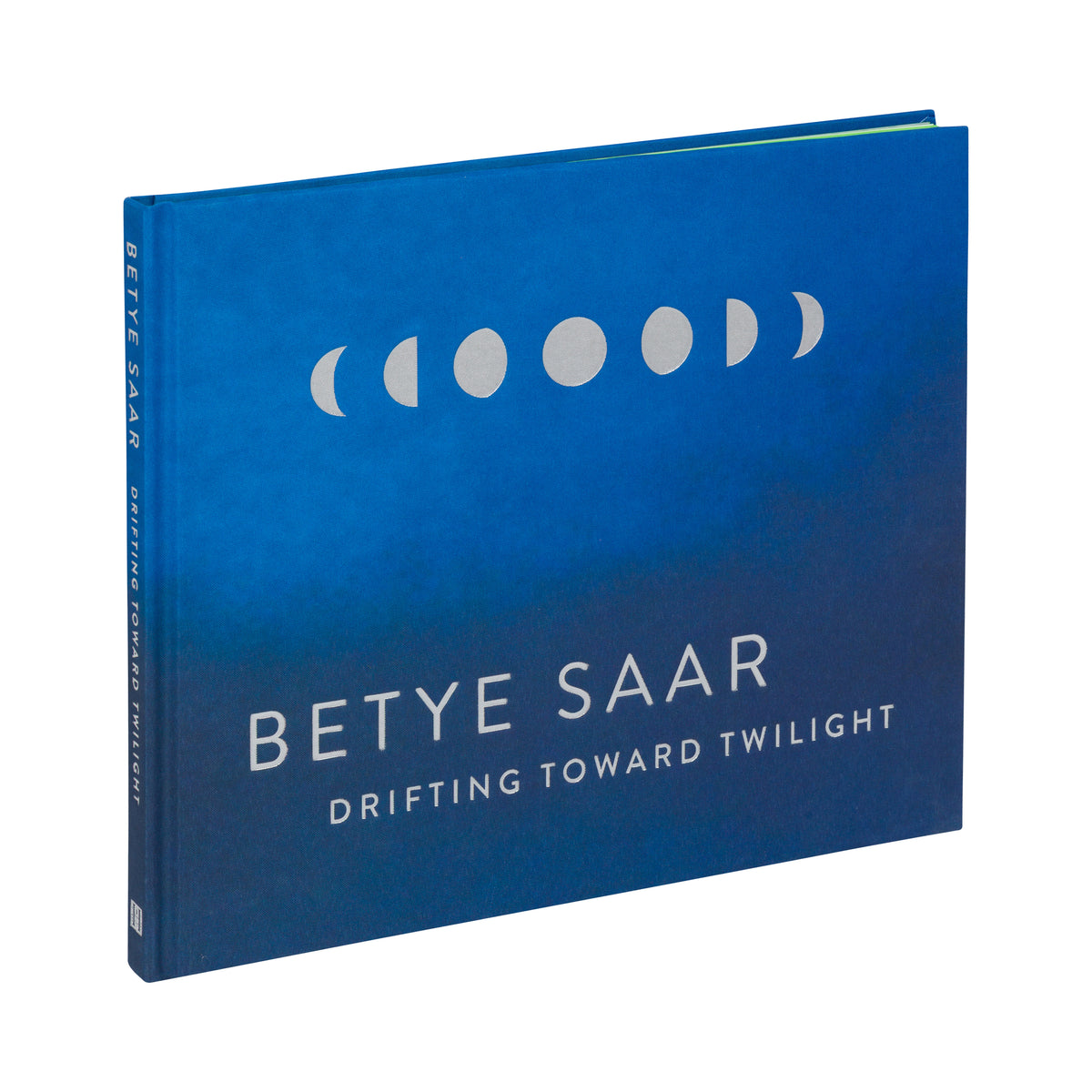Blue book cover with white text and moon phase symbols for Betye Saar's 'Drifting Toward Twilight'.