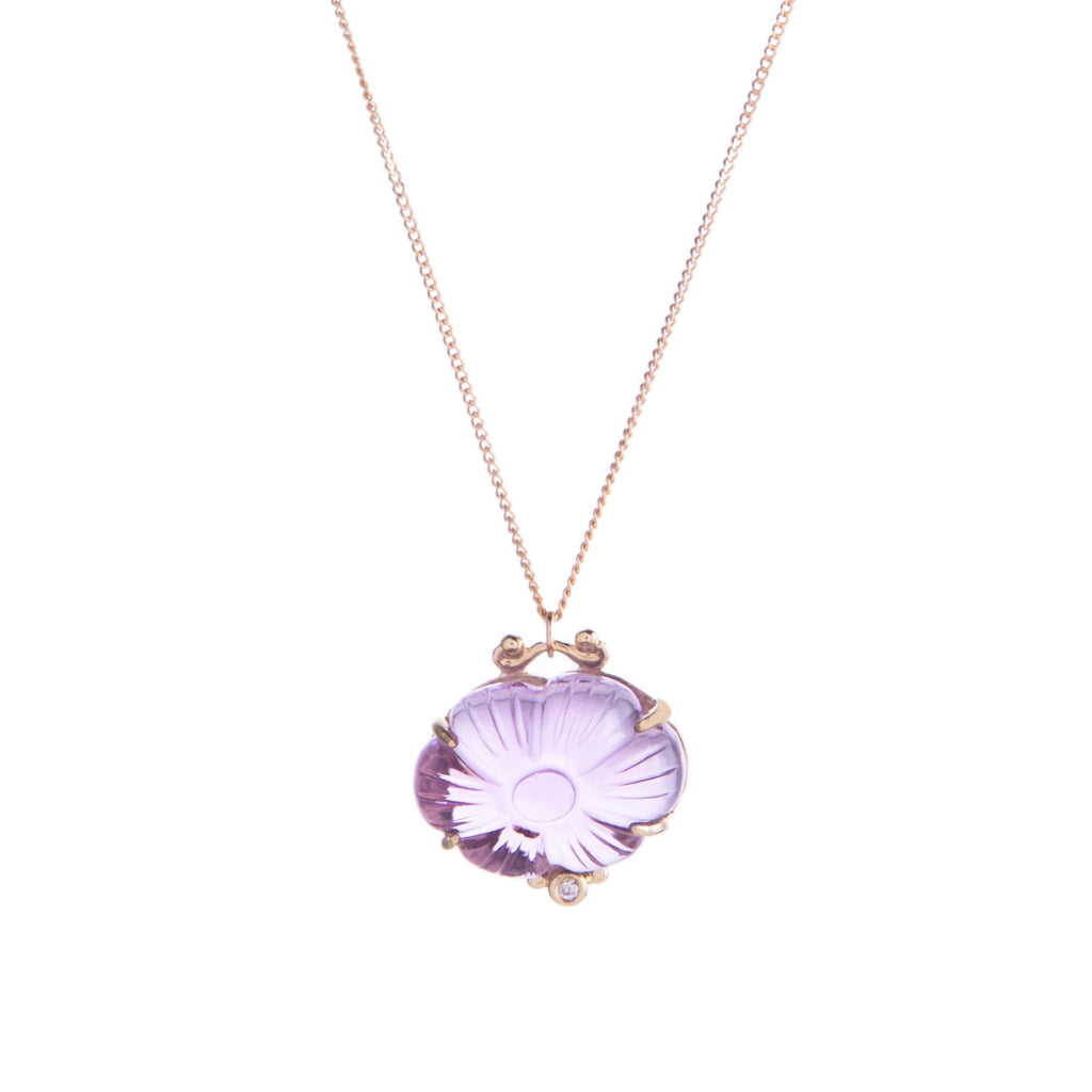 This high-quality dahlia necklace features a hand-cut dahlia that comes in either lemon topaz or amethyst, as well as a sparkling white diamond inlay. 