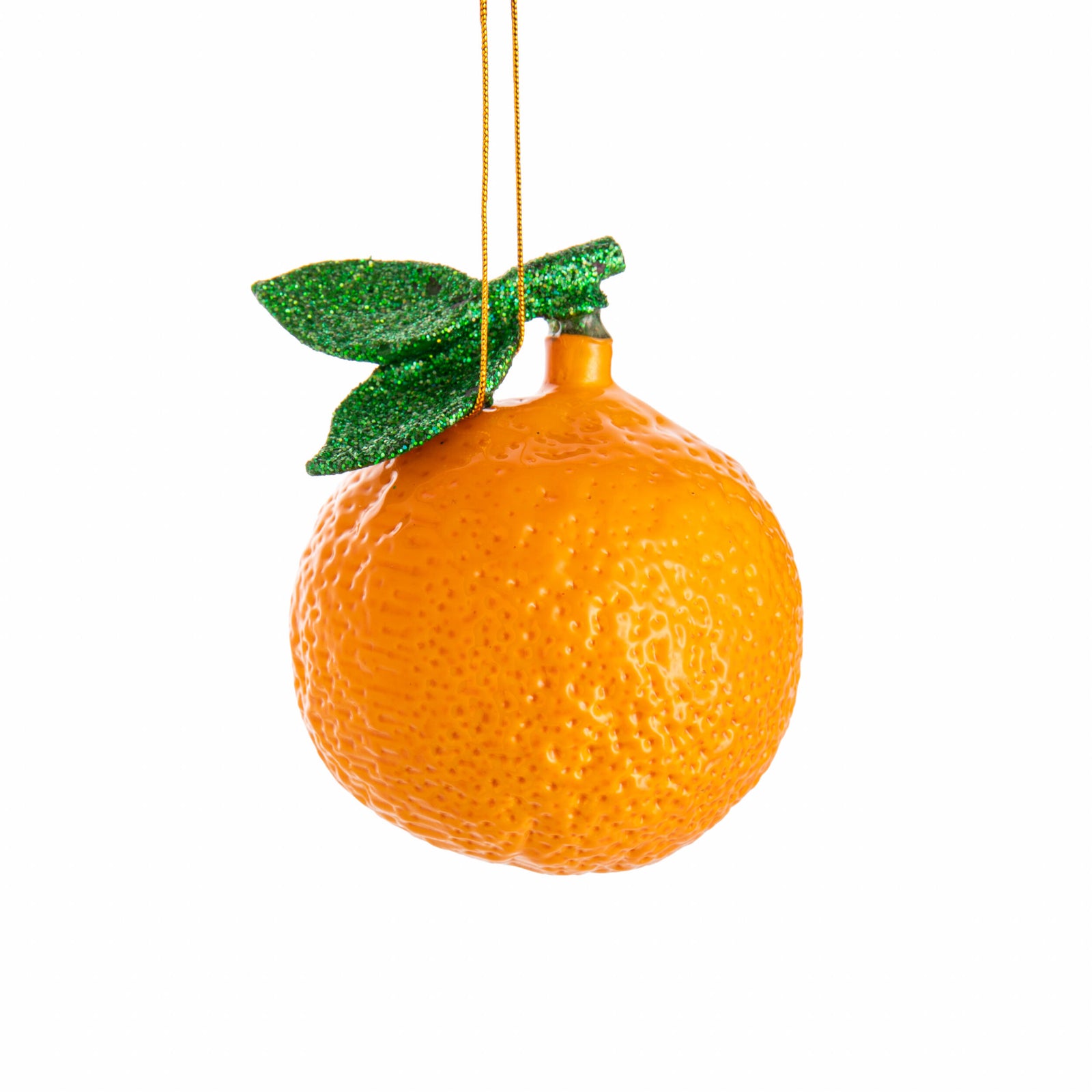 Decorative orange ornament with green leaf on a white background