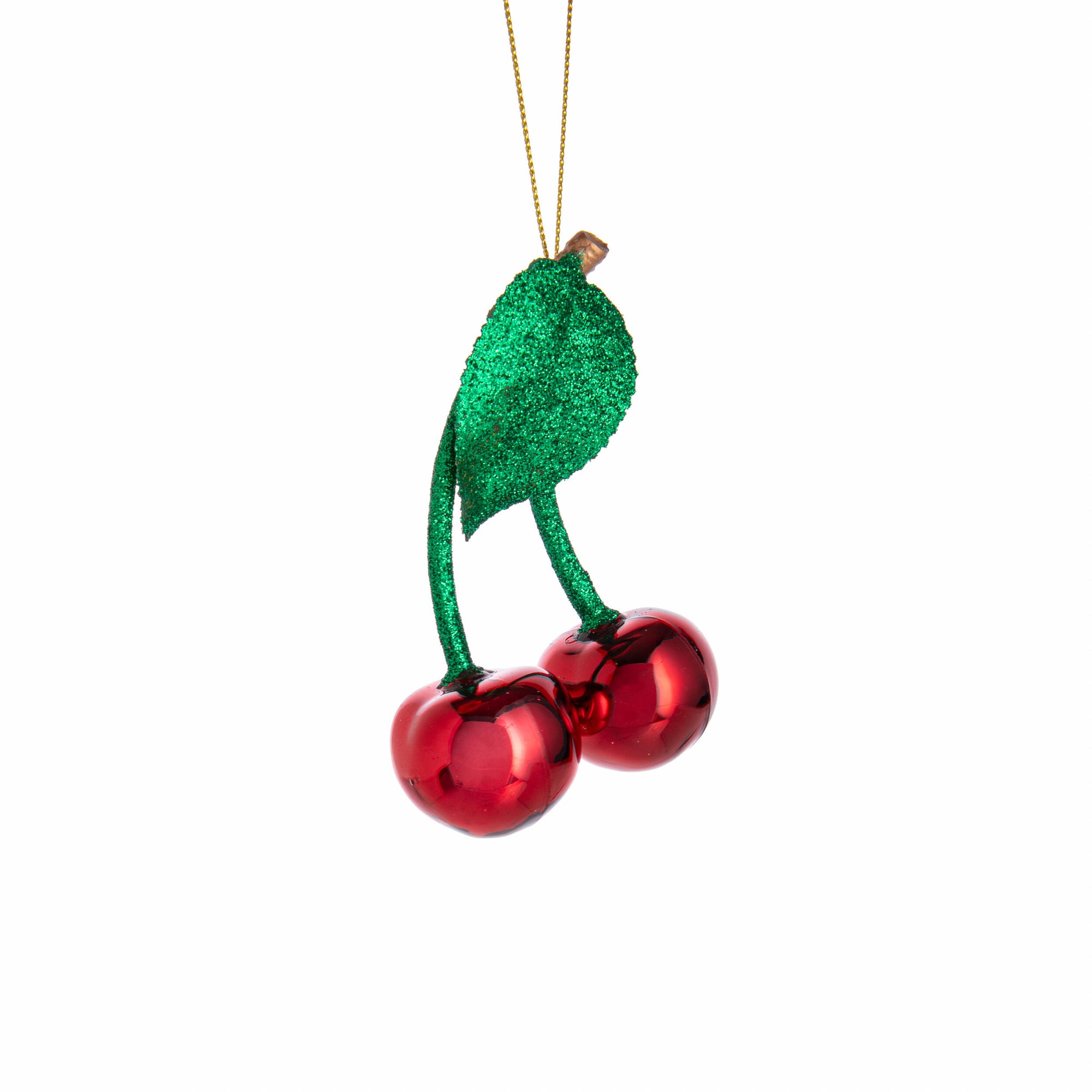 Decorative ornament shaped like a green leaf with red berries on a white background