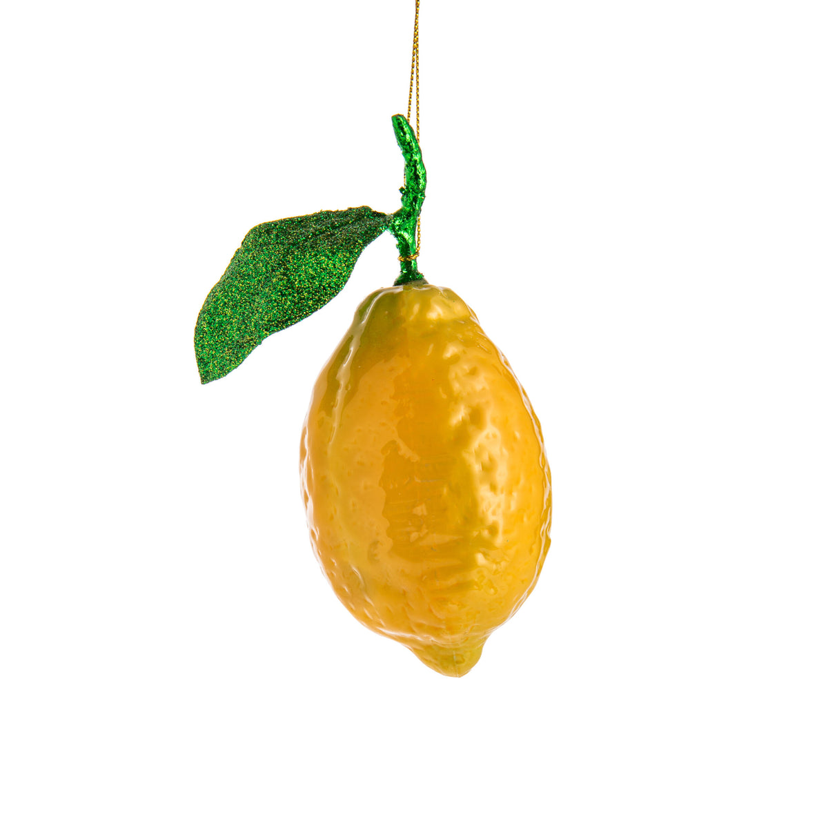 Decorative lemon ornament with a green leaf on a white background