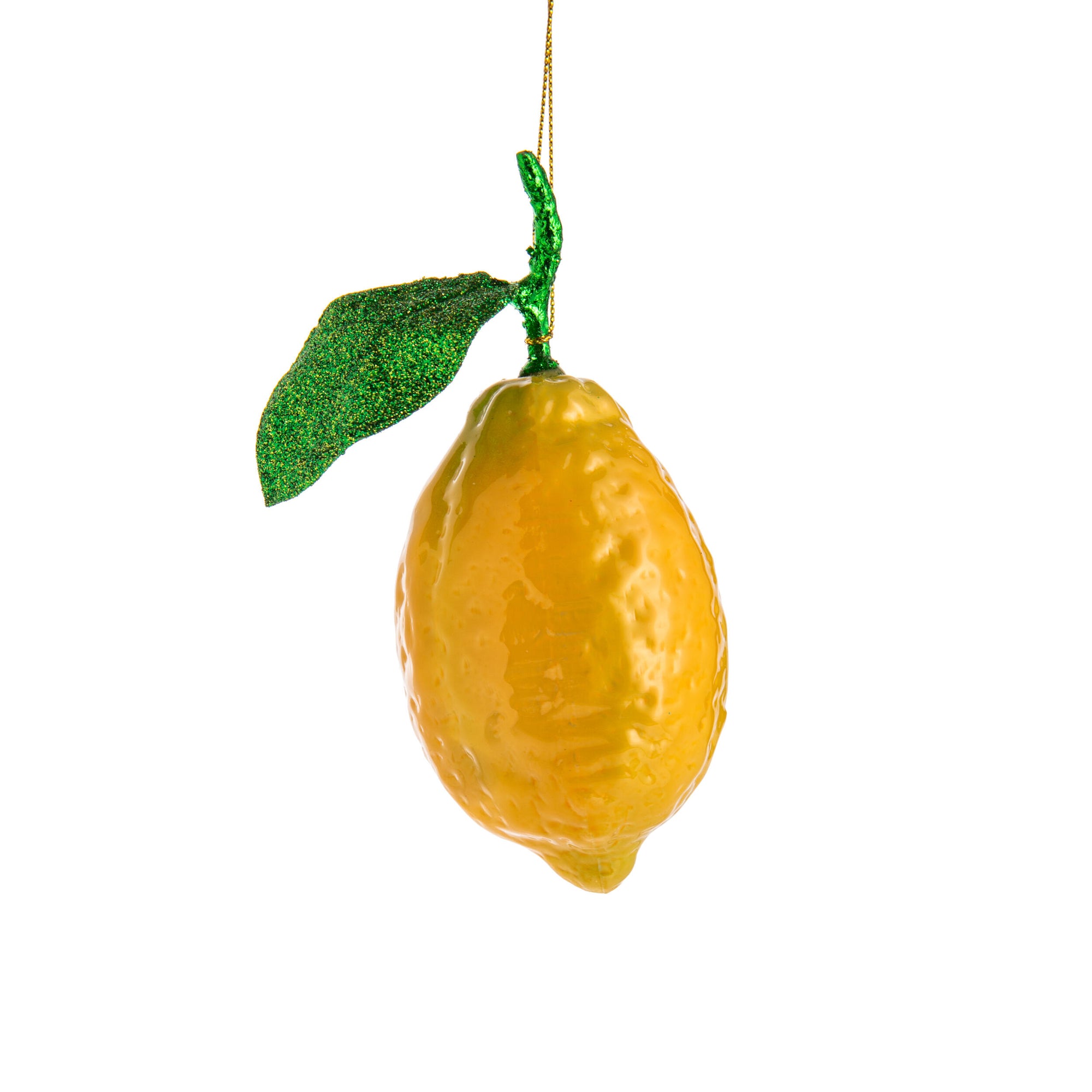 Decorative lemon ornament with a green leaf on a white background