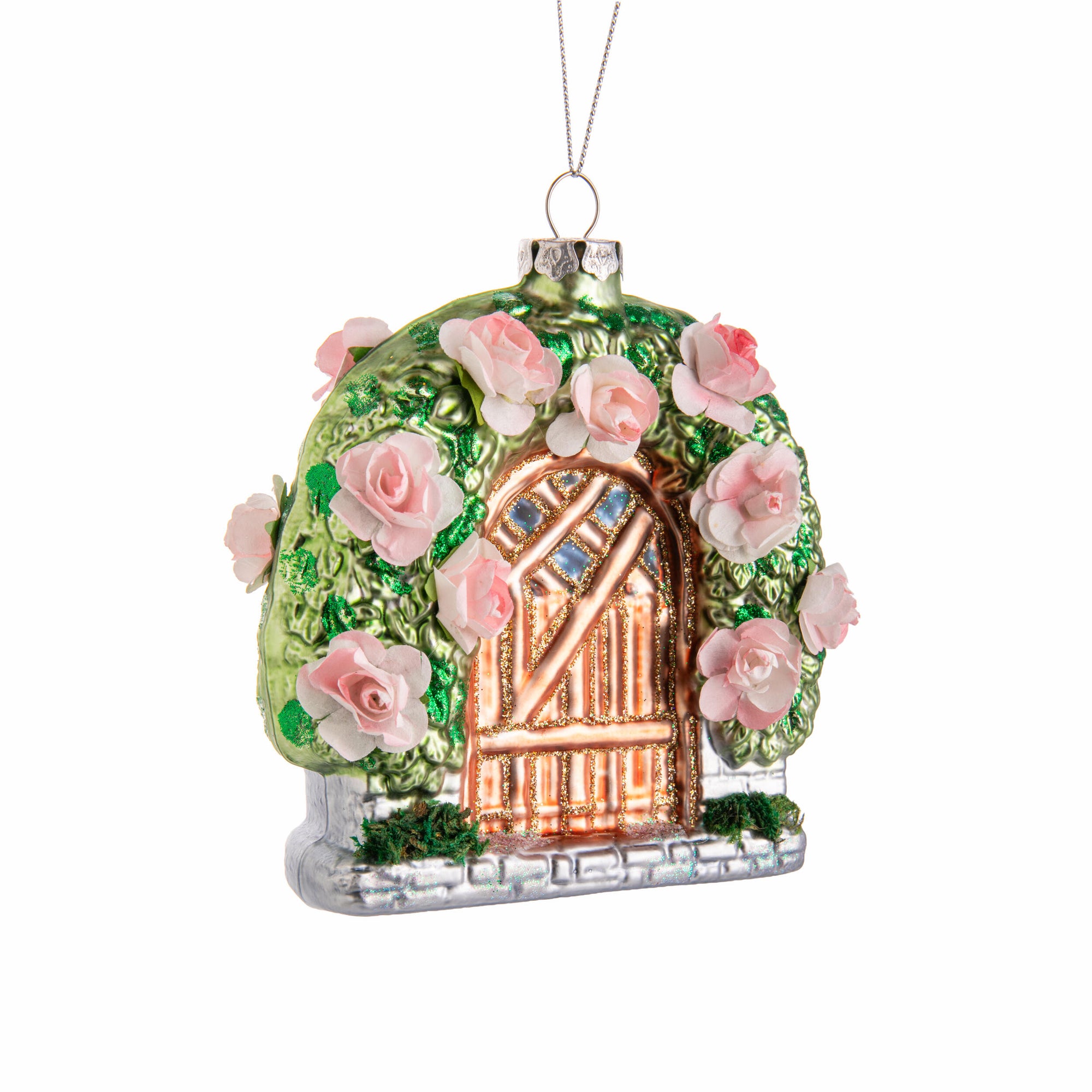Decorative glass ornament shaped like a house with pink roses on a white background