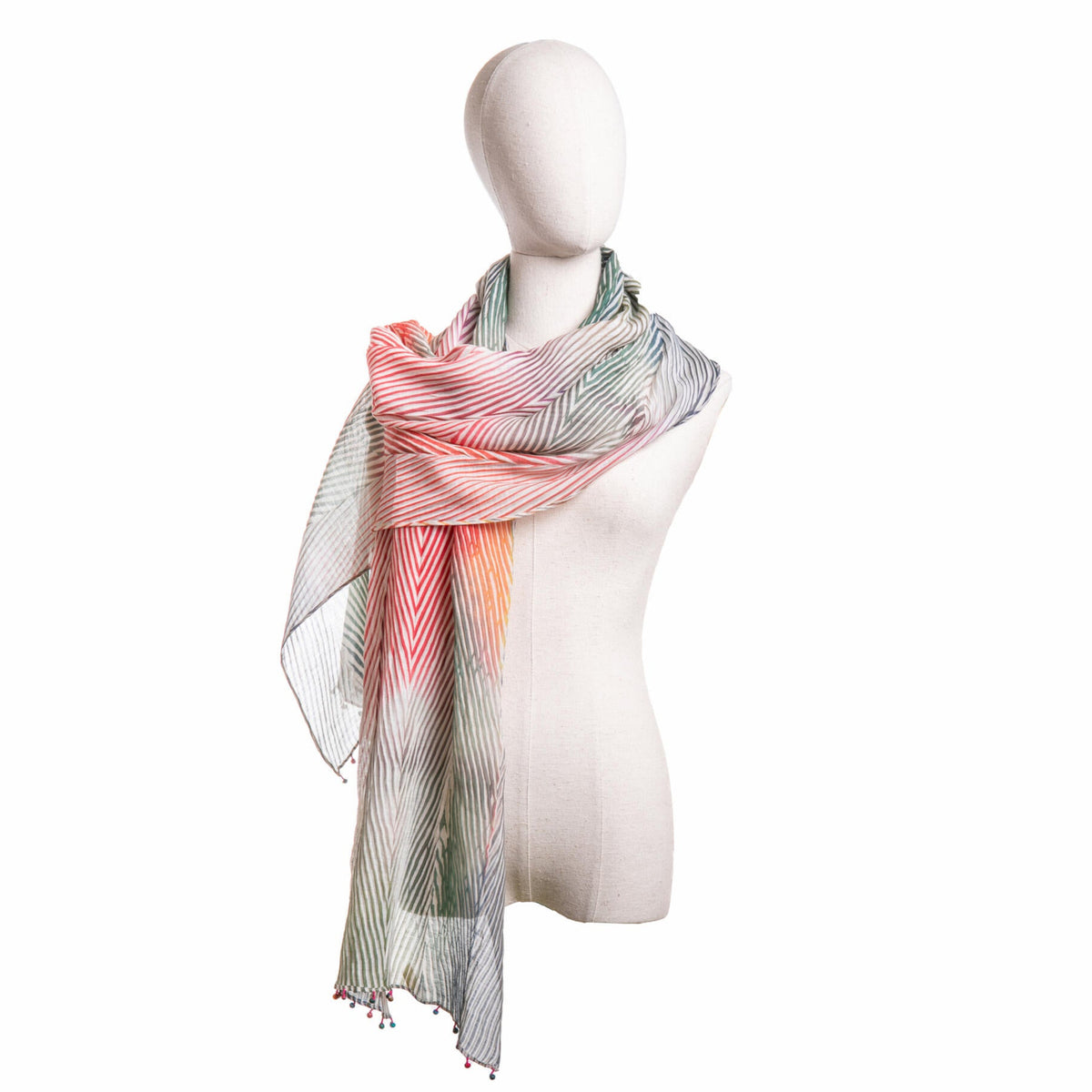 Mannequin wearing a colorful scarf on a white background