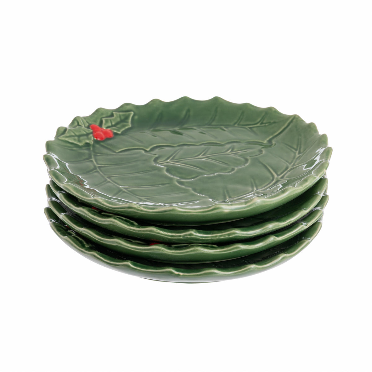Stack of green ceramic plates with leaf design on a white background