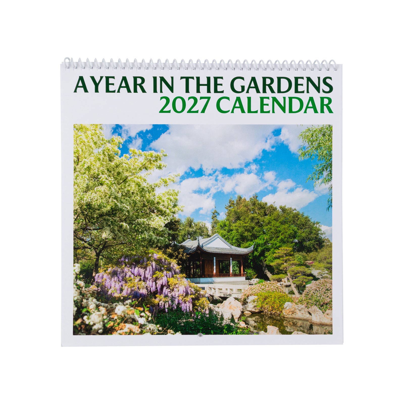 A spiral-bound 2027 calendar titled 'A YEAR IN THE GARDENS 2027 CALENDAR' shown on a white background. The cover features a colorful photograph of aThe Huntington's Chinese Garden with a pavilion, flowers, trees, and blue sky.
