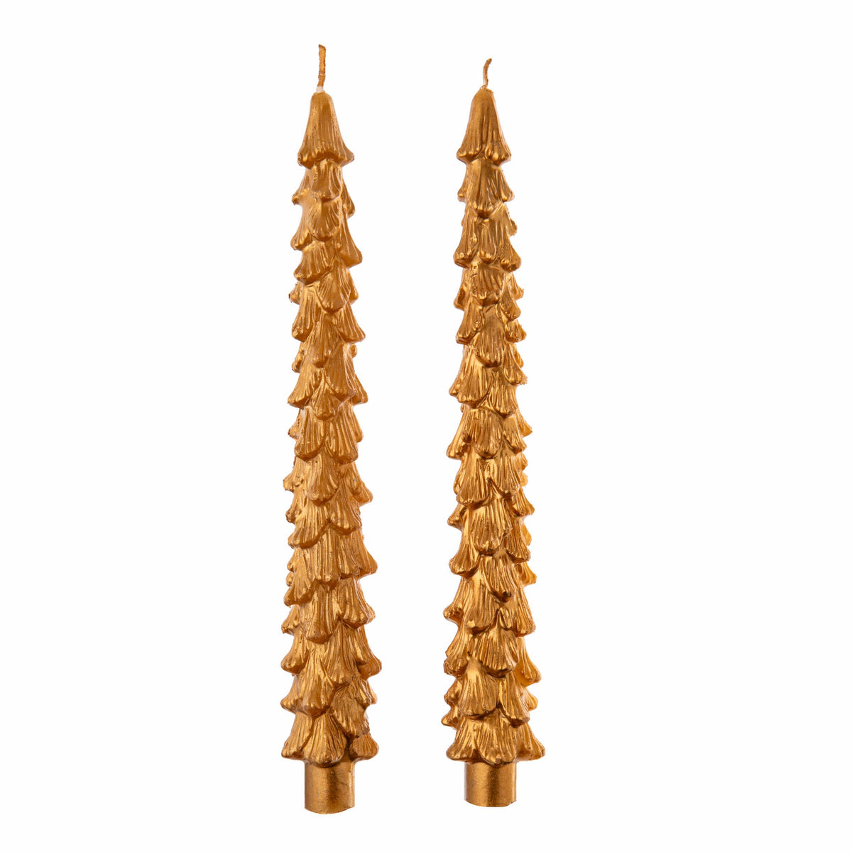 Two tall, decorative gold colored candles with a pine tree design on a white background