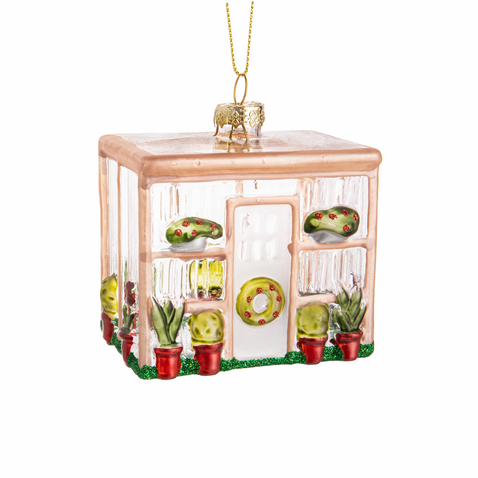 Glass greenhouse ornament with plants inside on a white background