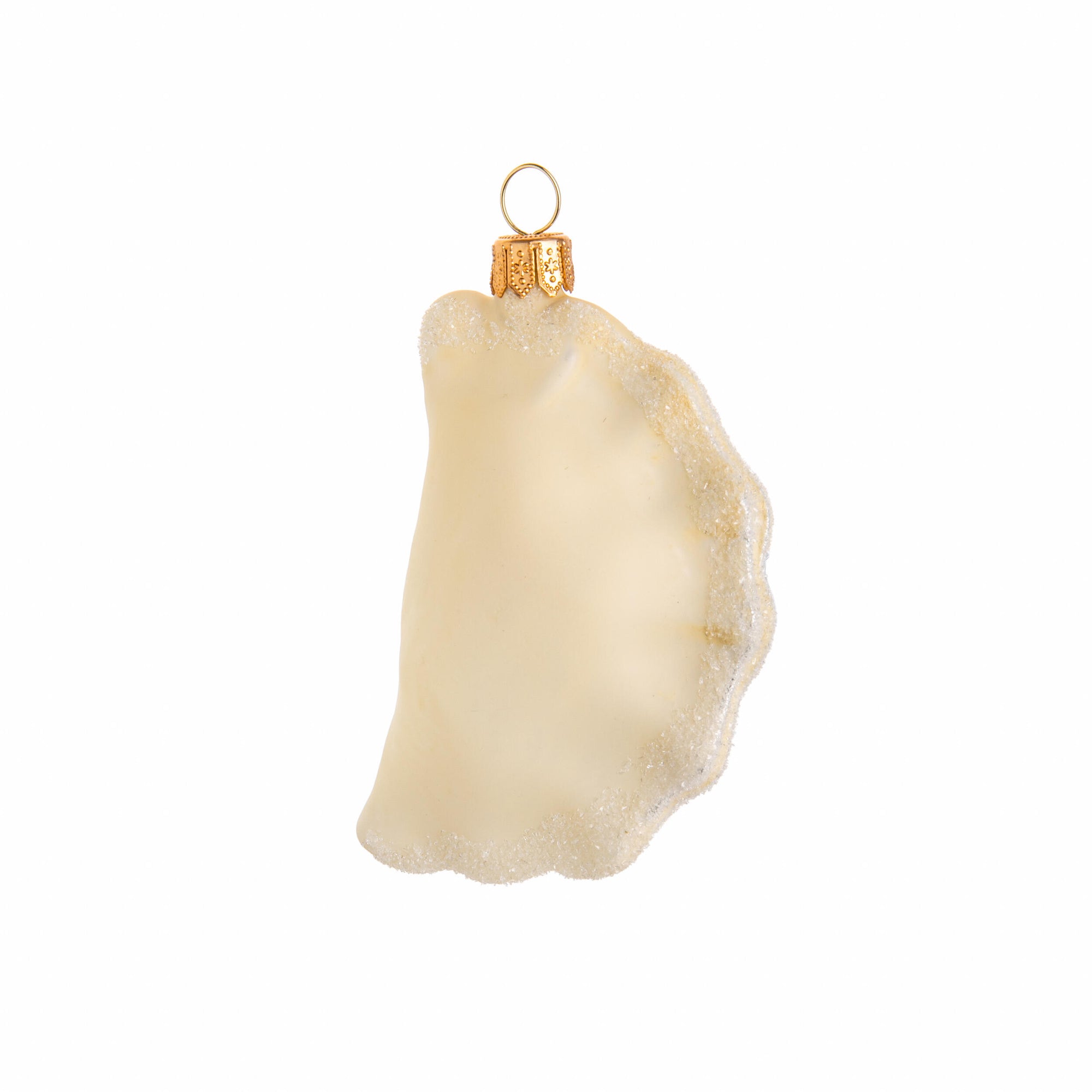 Glass ornament shaped like a dim sum dumpling on a white background