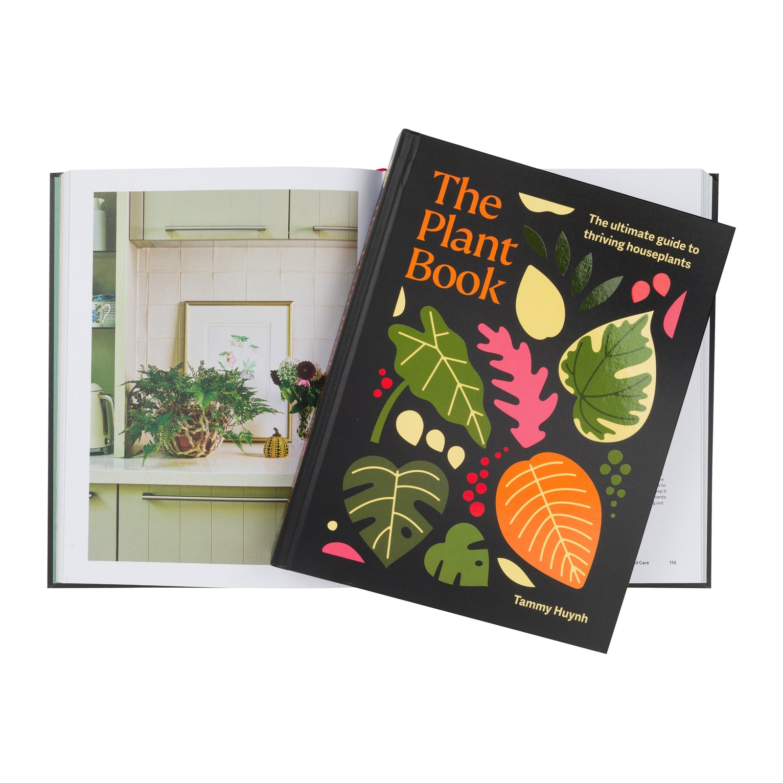 The Plant Book by Tammy Huynh, featuring a black cover with colorful illustrated leaves and bold orange title text.