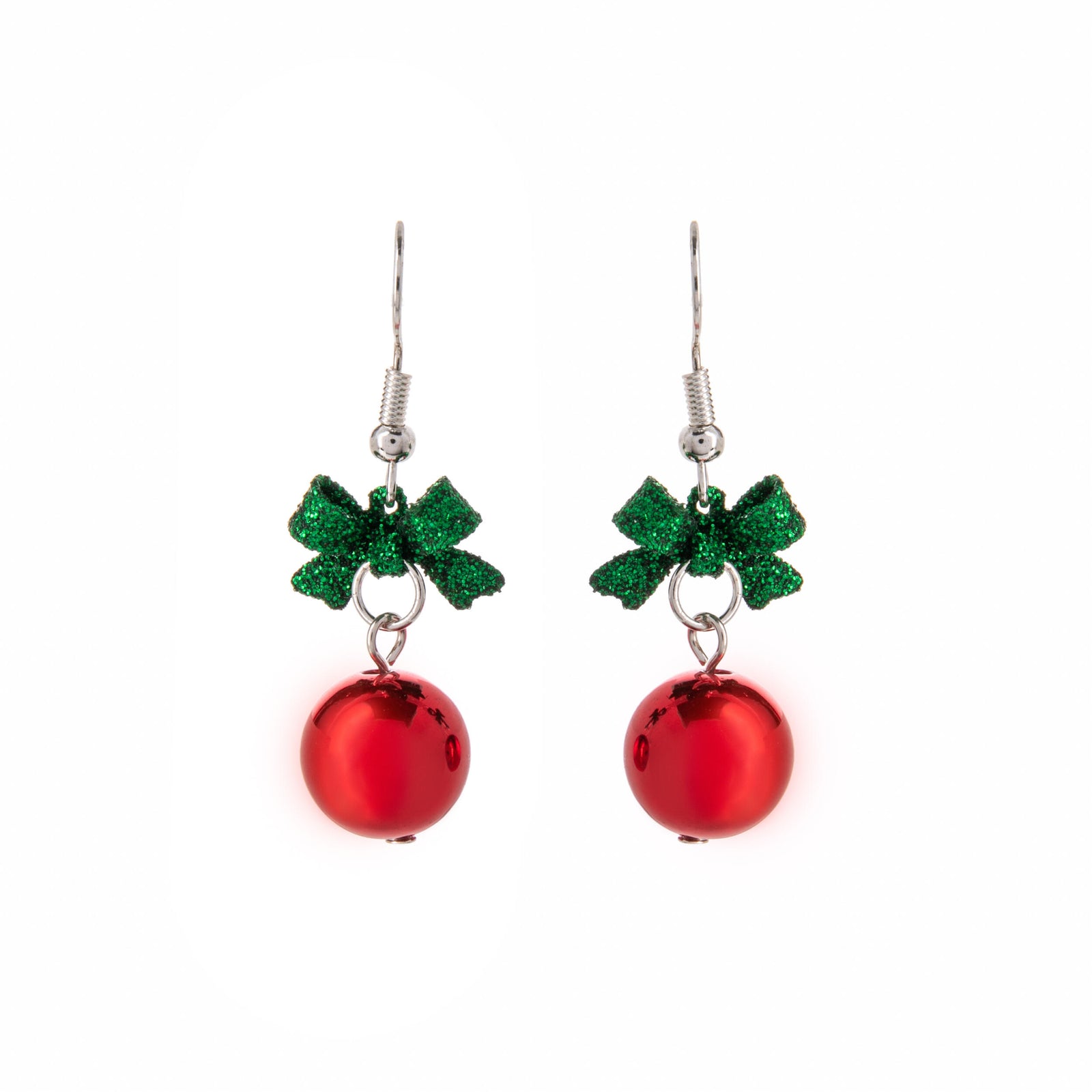Pair of red Christmas ball earrings with green bows on a white background