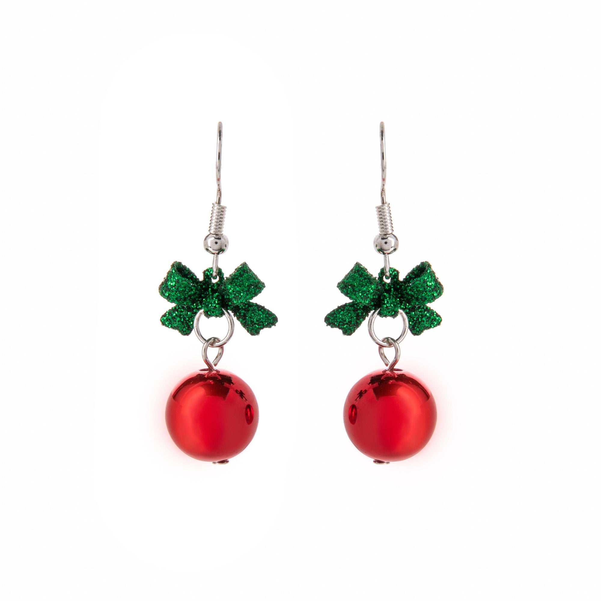 Pair of red Christmas ball earrings with green bows on a white background