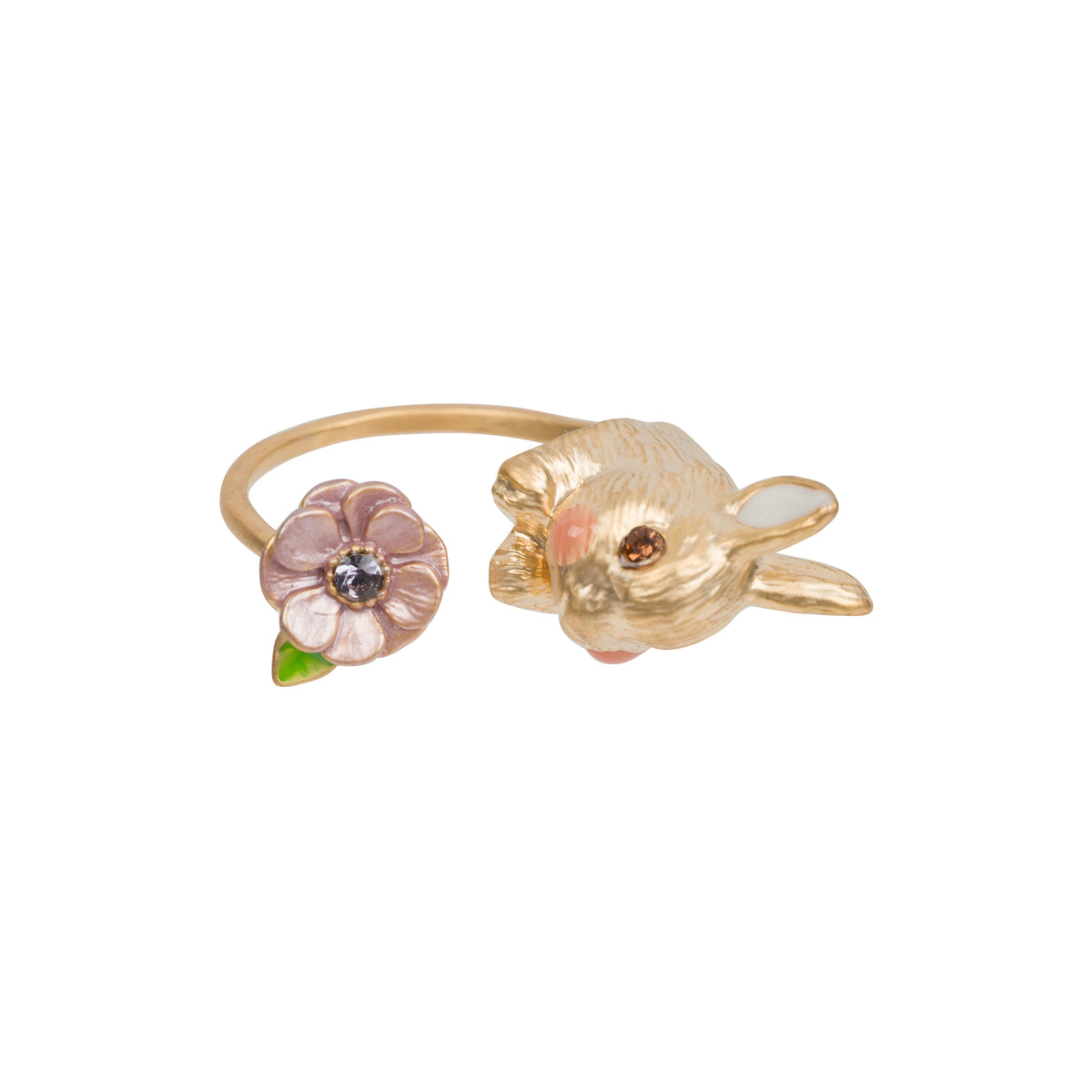 A gold-toned open ring shaped like a rabbit head next to a small pink flower with a green leaf and a clear center stone, shown on a plain white background.