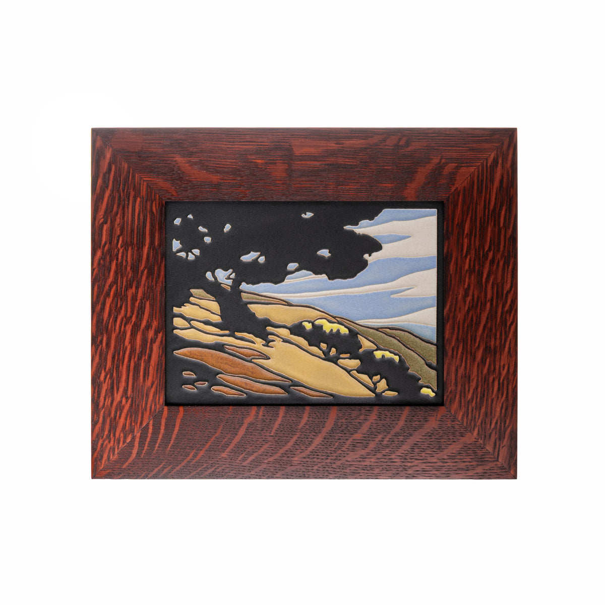 Framed tile  artwork of a landscape with trees and mountains on a white background