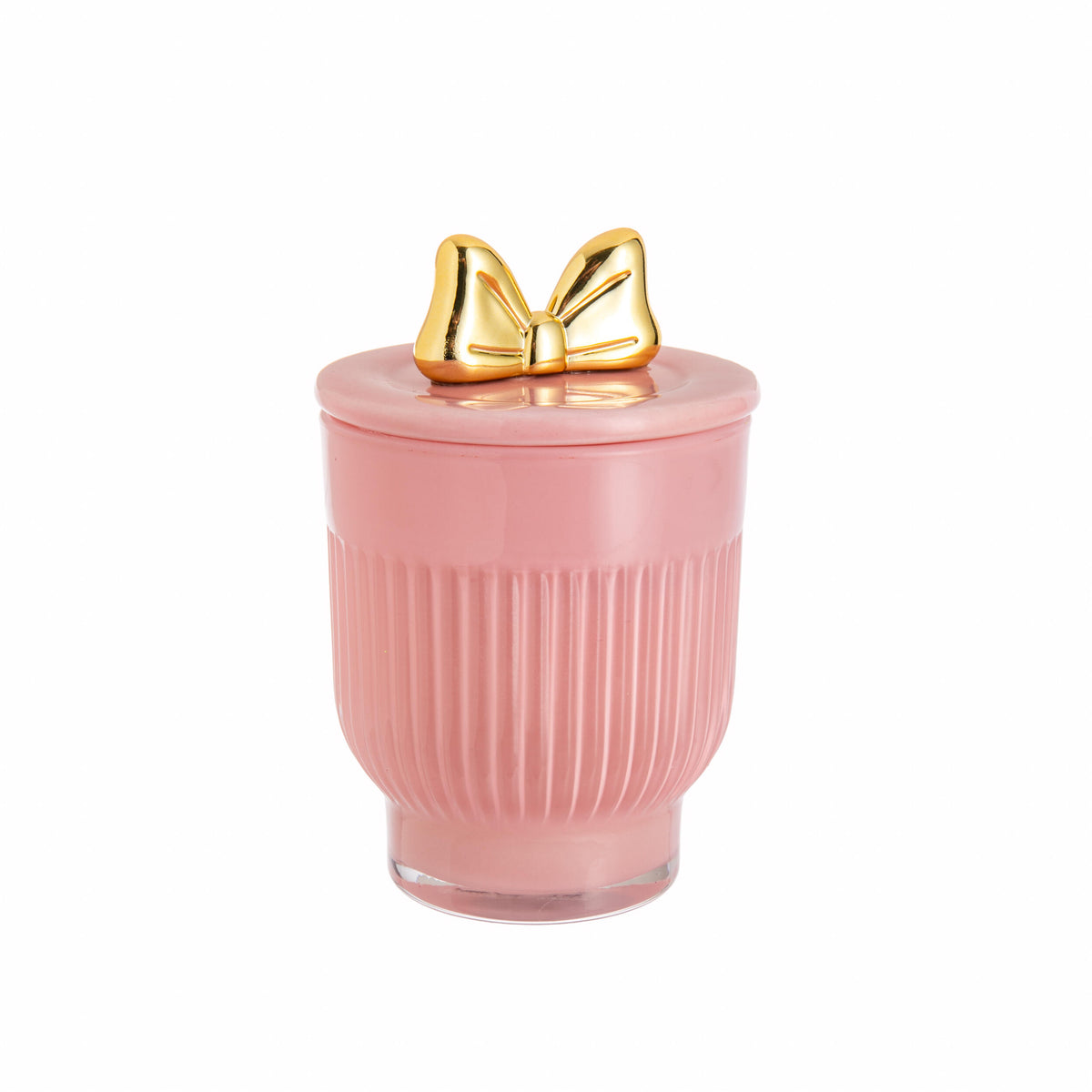 Pink glass container with a gold bow on the lid containing a rose-scented candle, on a white background