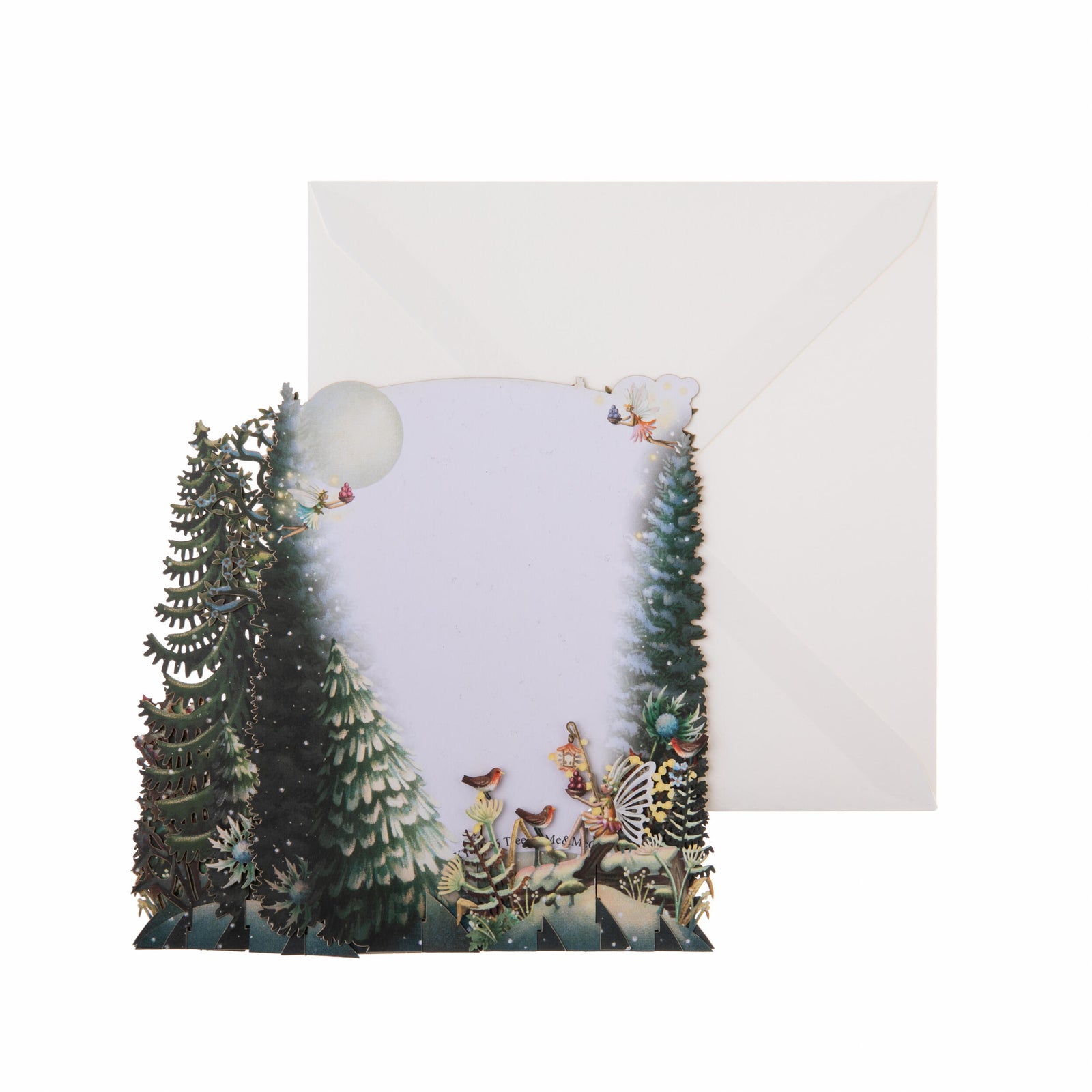 Decorative paper cutout pop up greeting card of a Christmas scene with trees and ornaments on a white background