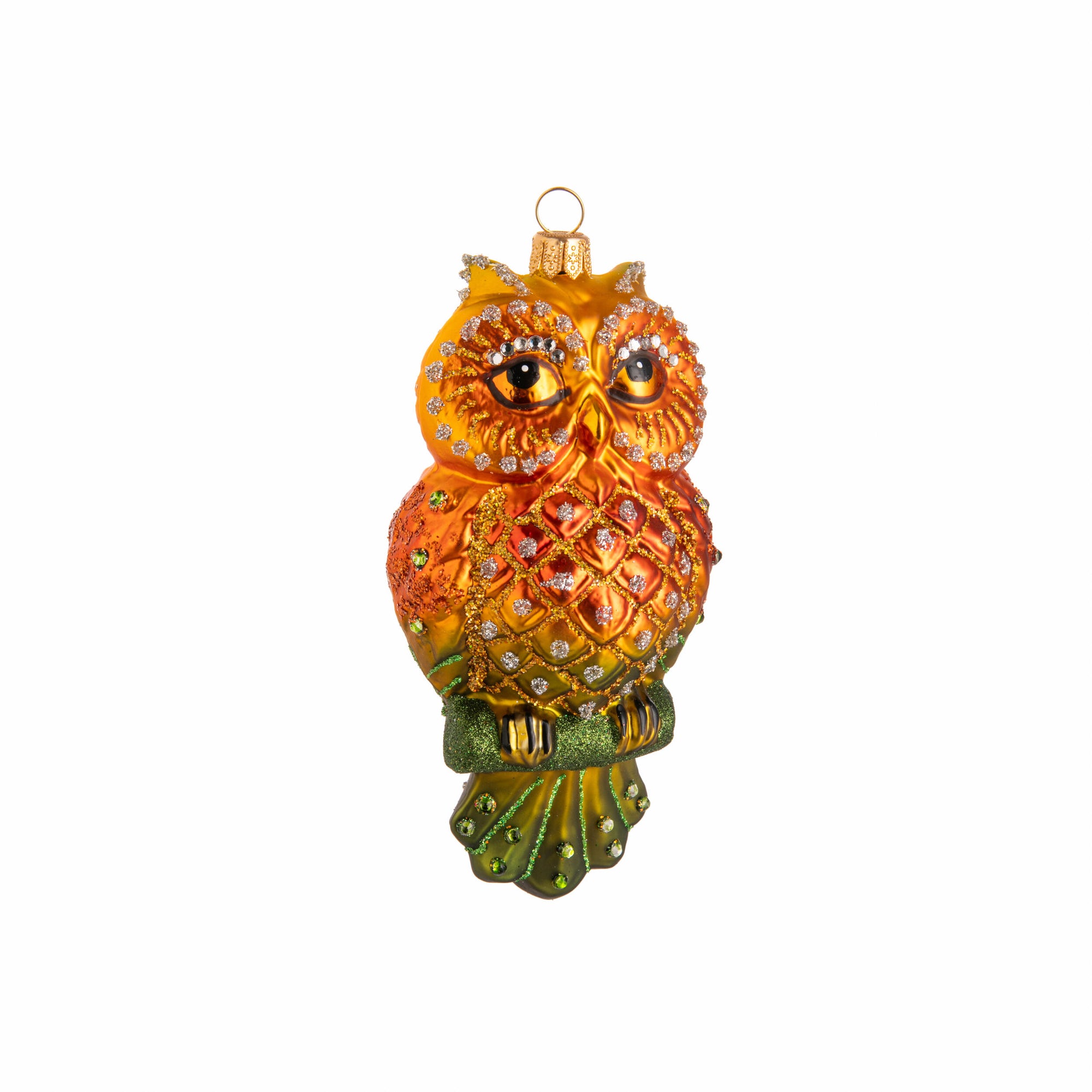 Decorative owl ornament with gold and orange colors on a white background
