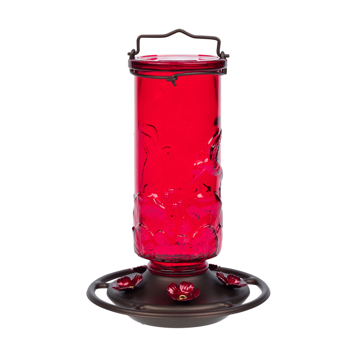 A red glass hummingbird feeder with a dark metal base, floral perches, and a top handle, shown on a plain white background.