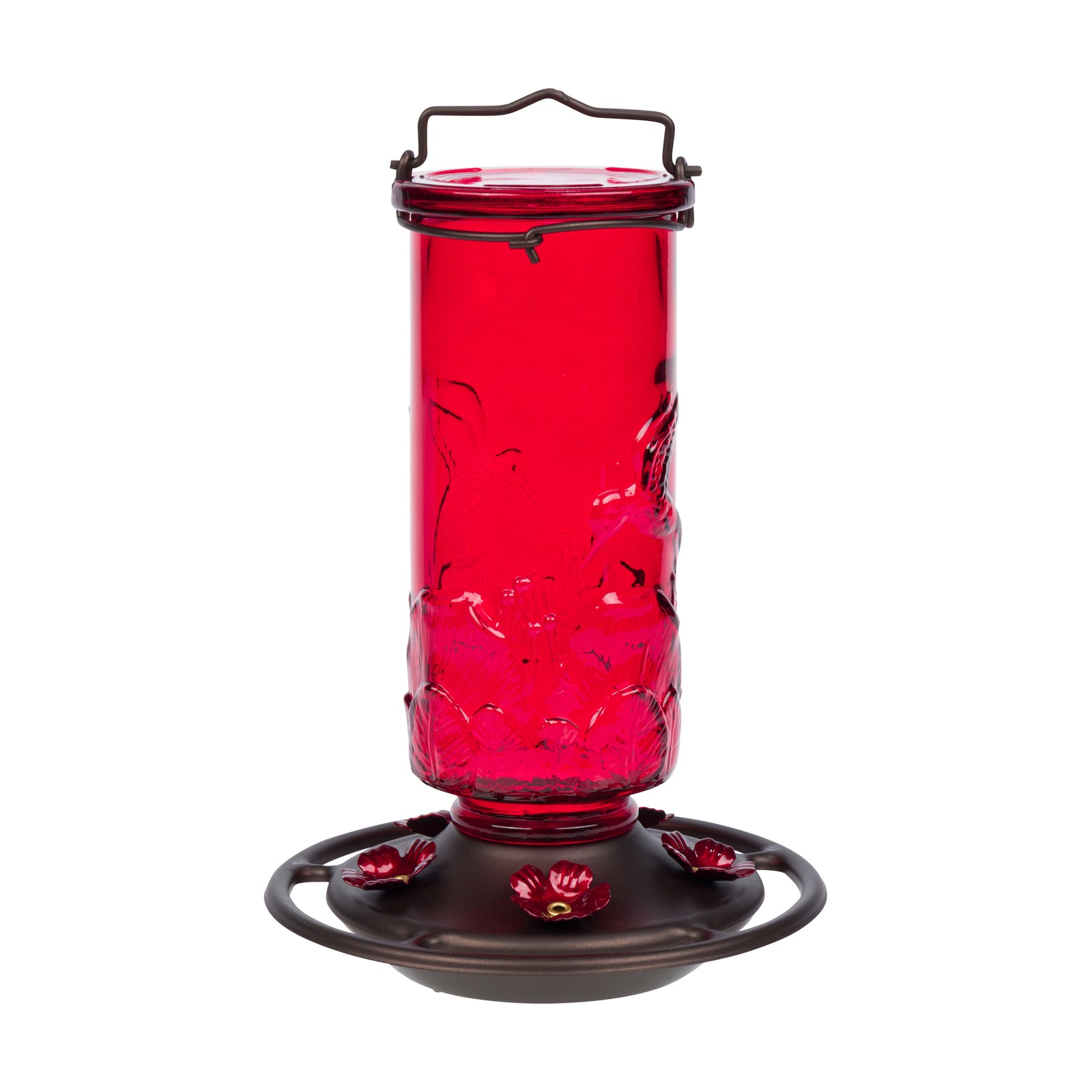 A red glass hummingbird feeder with a dark metal base, floral perches, and a top handle, shown on a plain white background.