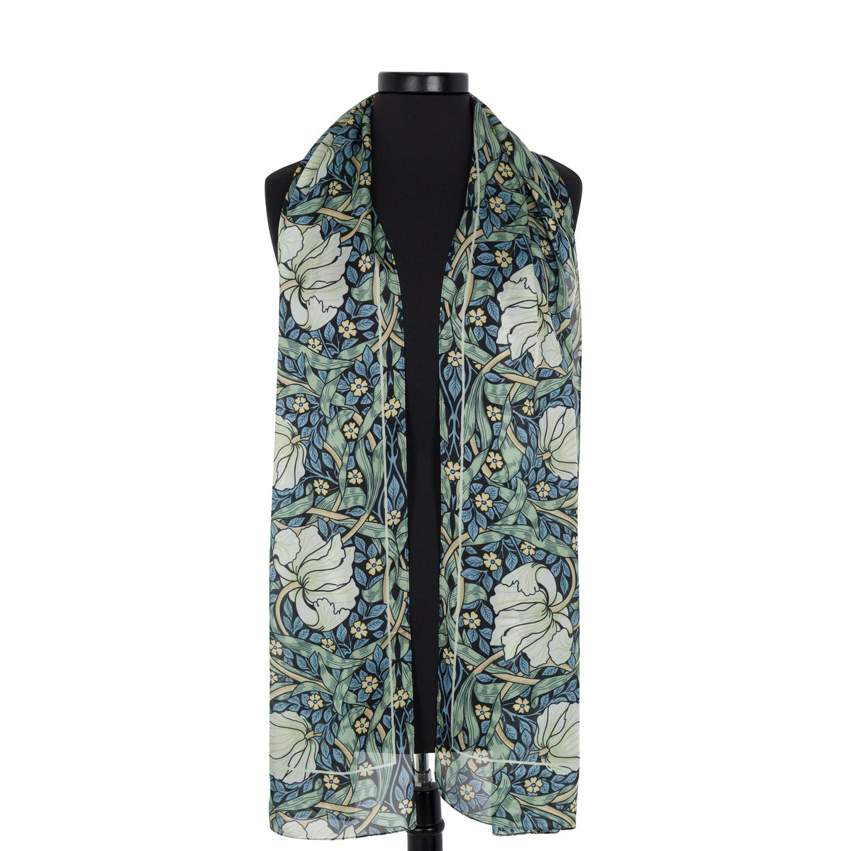 A lightweight scarf with a William Morris Pimpernel print, featuring a flower and vine pattern in muted blue, sage green, cream, and beige, draped on a black mannequin torso against a plain white background.